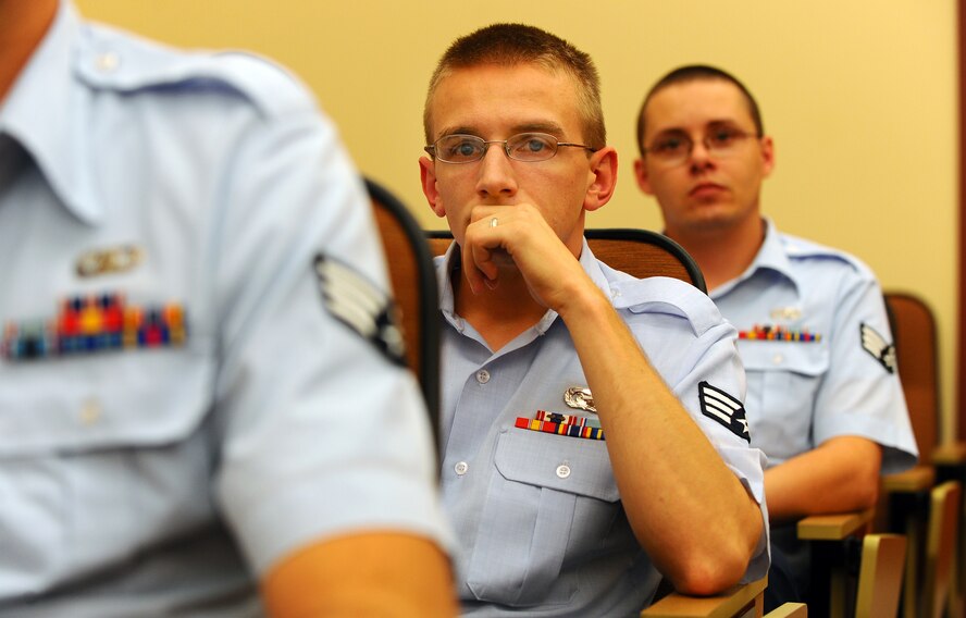OFFUTT AIR FORCE BASE Neb. ? Senior Airman James T. Yates, current student enrolled at the Airmen Leadership School, listens to Brig. Gen. John N.T. Shanahan, 55th Wing commander, give an informal discussion on topics concerning leadership and management.  ALS is a five week Air Force program designed for the development of Airmen into effective supervisors and is the first available professional military education course that an enlisted member will encounter in their career. U.S. Air Force photo by Josh Plueger.