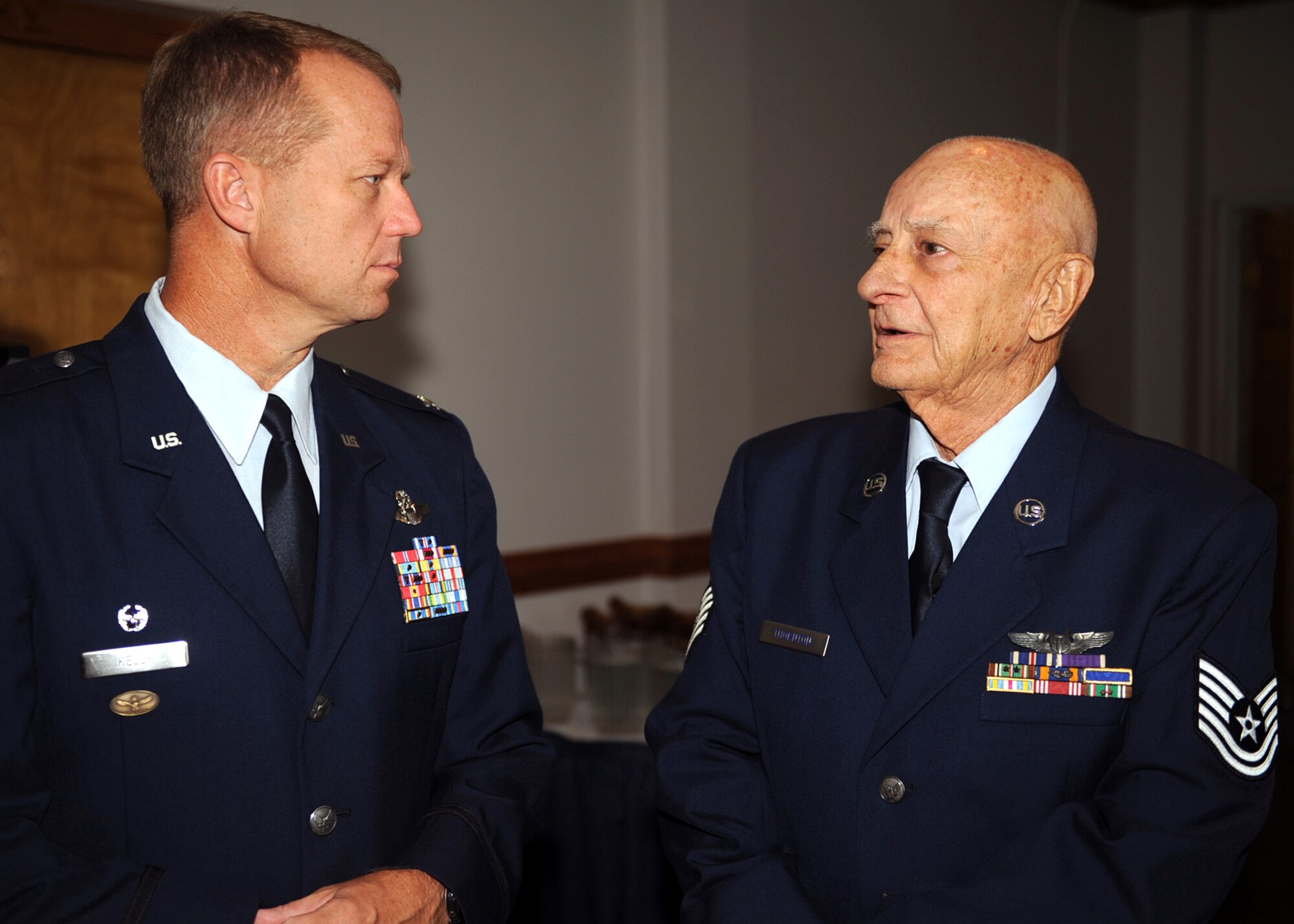 Col. Mark Kelly speaks with World War II Tech. Sgt. Holt Thornton, before a medal presentation ceremony Aug. 29, 2009 at Seymour Johnson Air Force Base, N.C., Aug. 29. Mr. Thornton's granddaughter, Carrie Bass, researched her grandfather's service to ensure he received all of the medals he earned during his World War II service. Mr. Thornton joined the Army Air Corps at 17 years old and served in Africa, France, Italy and other various parts of Europe during from 1941 to 1944. Colonel Kelly is the 4th Fighter Wing commander. (U.S. Air Force photo/Senior Airman Ciara Wymbs) 
