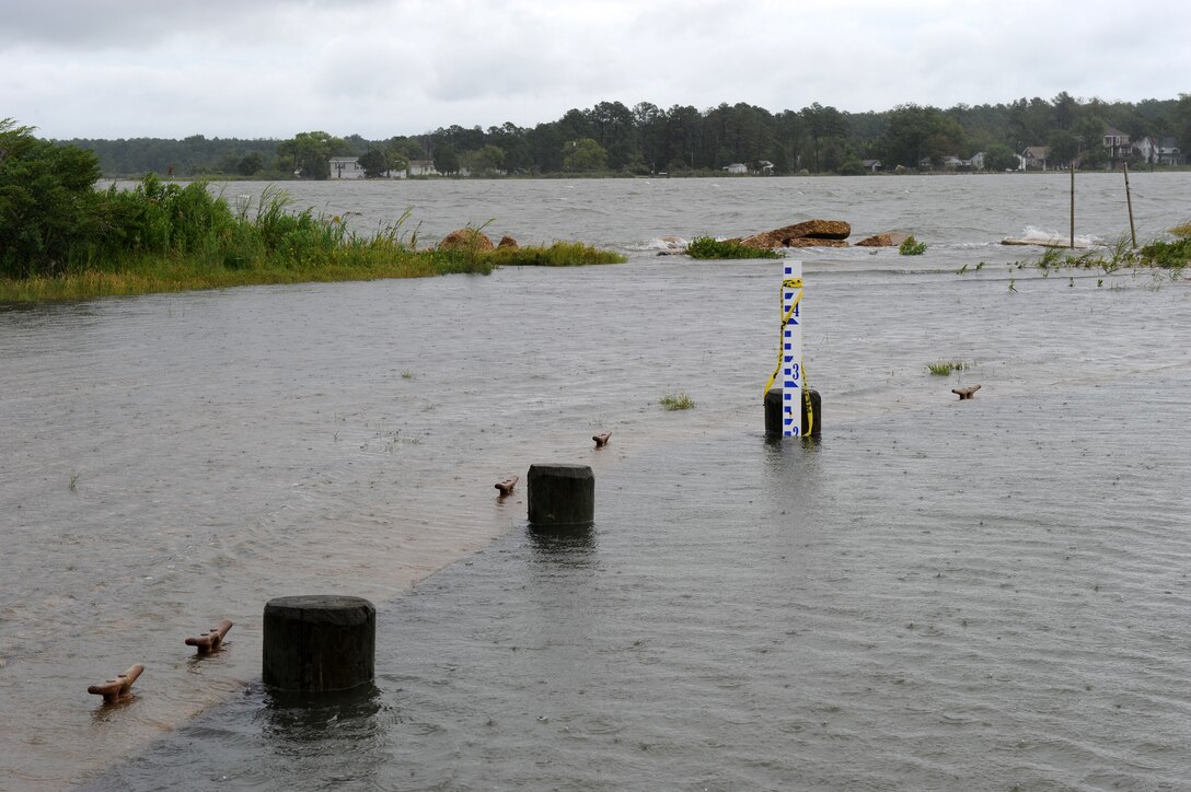 LANGLEY AIR FORCE BASE, Va. --  Beware of flash flooding, standing water.  Although Langley isn't often affected by hurricanes, severe weather is expected throughout the summer months, and flash flooding is a dangerous byproduct of torrential downpours. Lt. Col. Matt Esper, 1st Fighter Wing Safety Office chief of safety, advises drivers to avoid driving through areas of standing water, as it may disable vehicles. Drivers cannot gauge how deep the water is and may be deeper than it appears. Also, drivers are advised to avoid driving through moving water. If you notice any areas of standing water on base, call the 1st Civil Engineer Squadron at 764-5342.  (U.S. Air Force photo/Senior Airman Zachary Wolf)