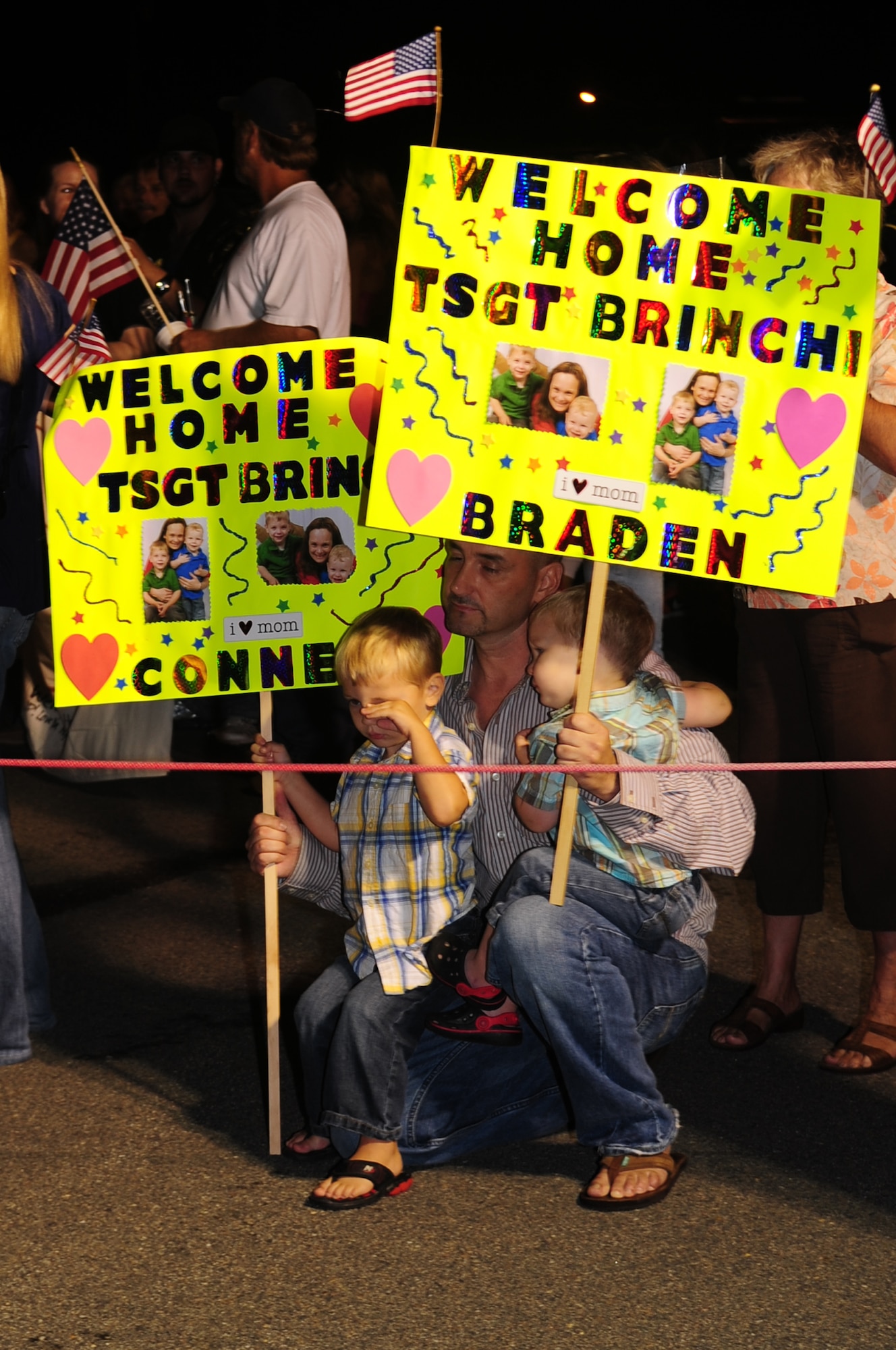 The family of Tech. Sgt. Angel Brinchi, 4th Aircraft Maintenance Squadron, waits for her return from a deployment on Seymour Johnson Air Force Base, N.C., Sept. 8, 2009. Airmen from the 4th Aircraft Maintenance Squadron were deployed with the 336th Fighter Squadron to maintain F-15E Strike Eagles deployed to Bagram Air Base, Afghanistan, in support of Operation Enduring Freedom. (U.S. Air Force photo by Airman 1st Class Rae Perry) 