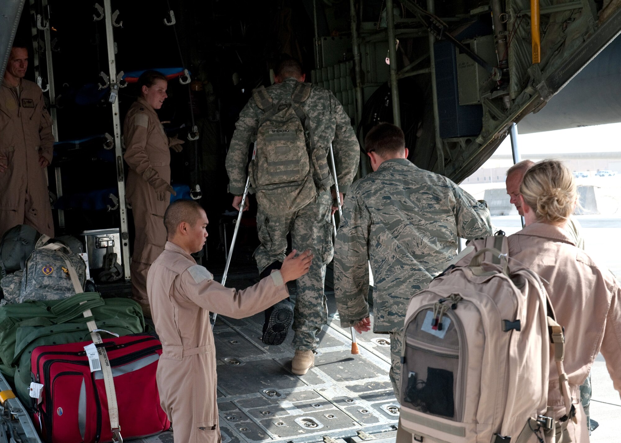 Airmen from the 379th Expeditionary Aeromedical Evacuation Squadron help load medical patients onto a C-130 Hercules for transportation Aug. 15, 2009, at an air base in Southwest Asia. Members of the 379 EAES transport patients from throughout Southwest Asia to established medical care facilities. (U.S. Air Force photo/Staff Sgt. Robert Barney) 