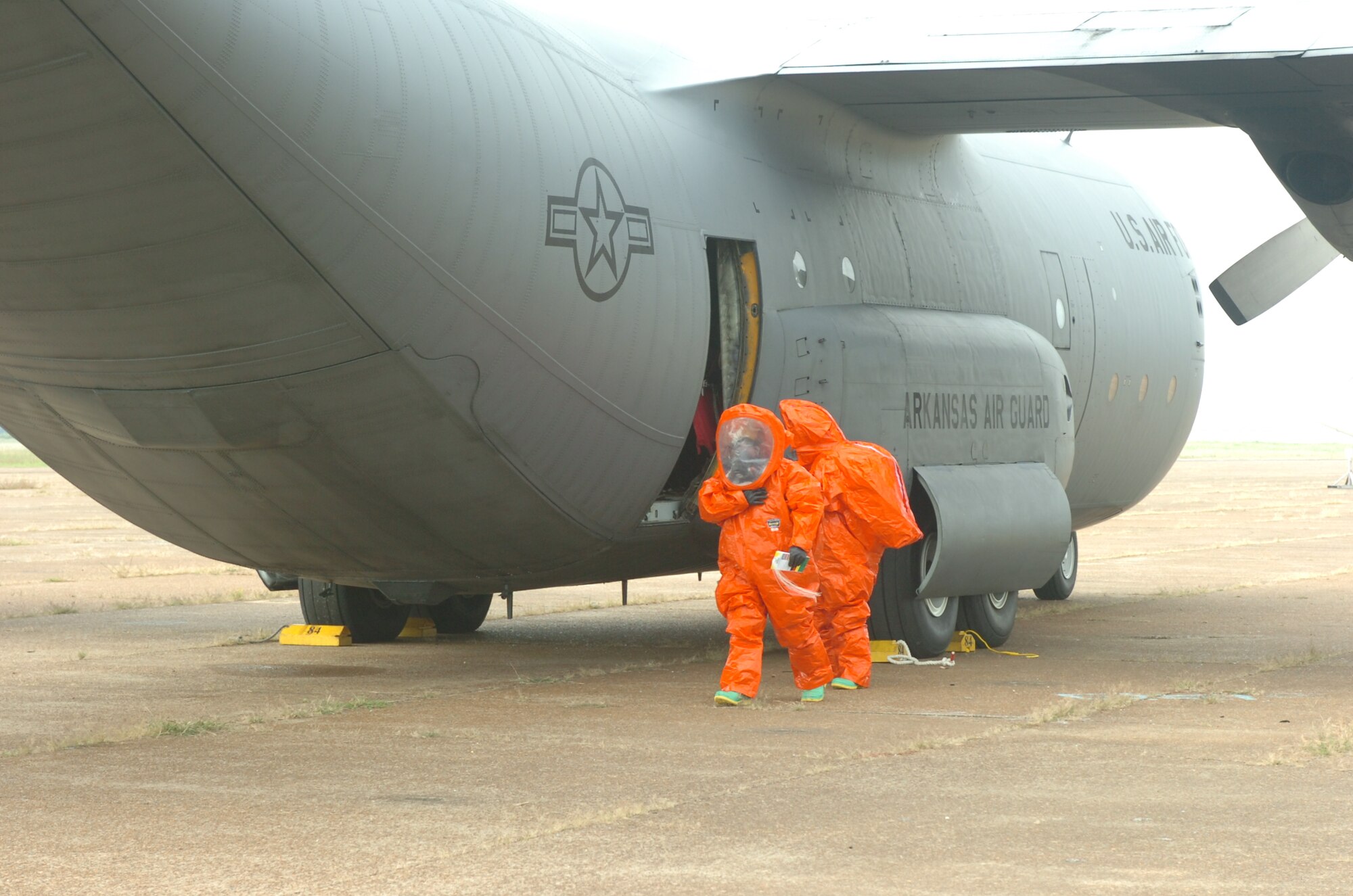 Members of the Walnut Ridge Fire Department's HAZMAT Response Team investigate a chemical spill and compartment fire aboard a C-130 aircraft during an exercise at the Walnut Ridge Airport on Tuesday, September 1, 2009.  The aircraft and crew were from the 189th Airlift Wing of the Arkansas Air National Guard based at Little Rock Air Force Base.  (Photo by Maj. Keith Moore, public affairs officer for the Arkansas Air National Guard.)