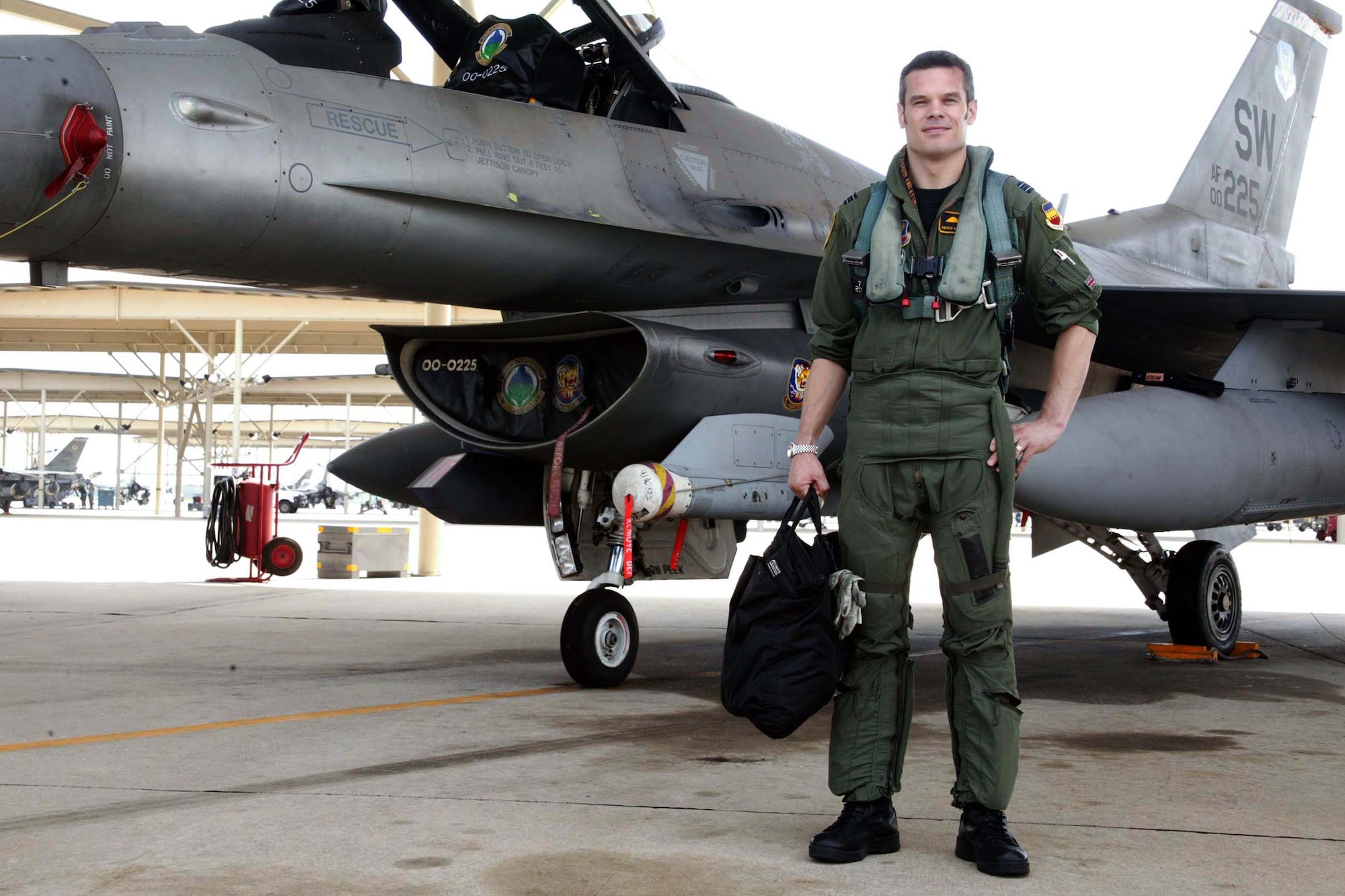 SHAW AIR FORCE BASE, S.C. -- Flight Lieutenant Andrew Mallery-Blythe, a Royal Air Force (United Kingdom) exchange pilot, stands in front a 79th Fighter Squadron F-16 here Aug. 21. The pilot exchange program trades fliers from different countries to learn how allies fly, train and fight. The purpose of the program is to improve international relations and pilot adaptability. (U.S. Air Force photo/Staff Sgt. John Gordinier)