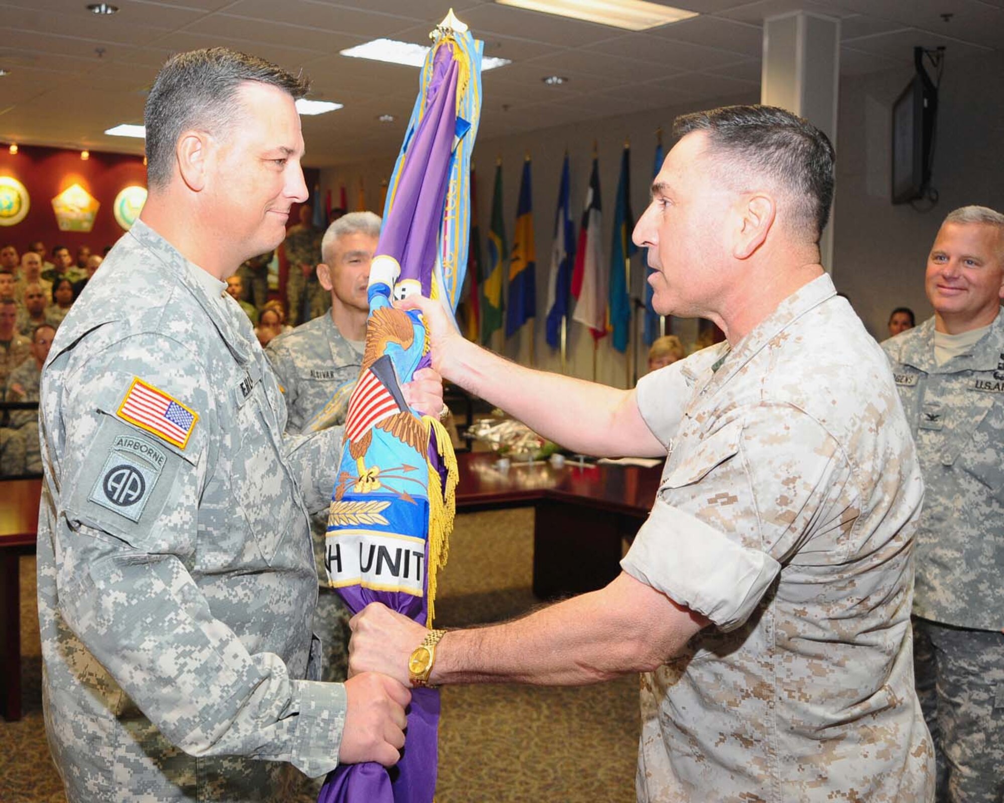 U.S. SOUTHERN COMMAND HEADQUARTERS, Miami — Army Col. Christopher Gehler recieves the Joint Task Force-Bravo guide-on for from Marine Corps Brig. Gen David Garza, chief of staff, U.S. Southern Command, during a change of command ceremony at the U.S. Southern Command Headquarters in Miami September 3. Joint Task Force-Bravo is one of three task forces under U.S. Southern Command. JTF-Bravo's primary mission is to provide command and control, administrative and logistical support for exercises, deployments and humanitarian and civic assistance projects conducted throughout Central America (Courtesy photo).