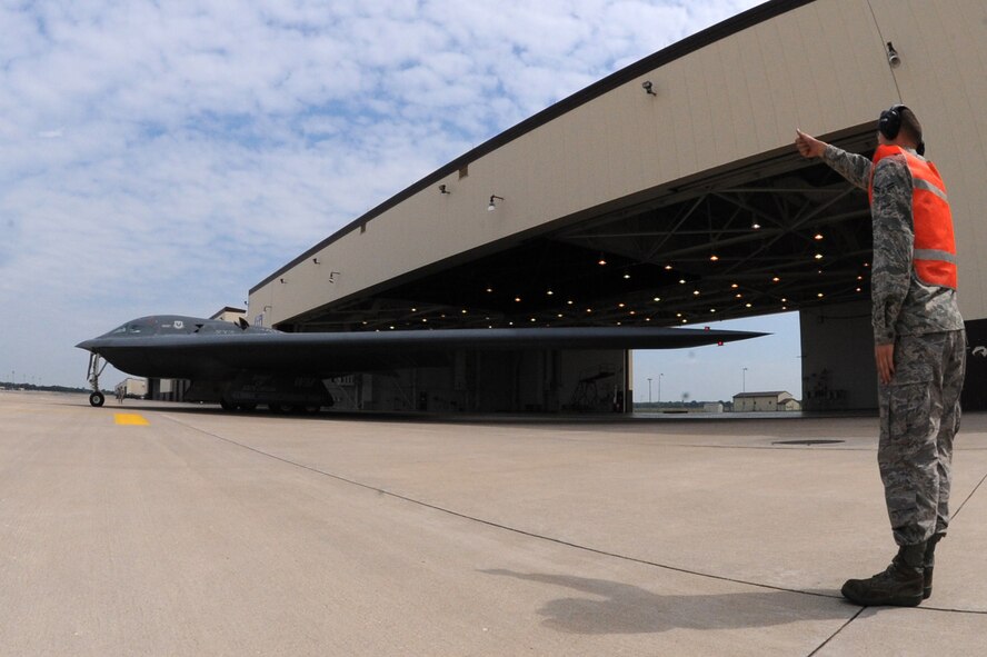 WHITEMAN AIR FORCE BASE, Mo. - Airman 1st Class Raymond Burgess, 509th Aircraft Maintenance Squadron, gives a thumbs up to the Total Force Integration crew taxing for launch, Sept.3. The B-2 Spirit is being flown by Maj. Ryan Bailey, 131st Bomb Wing, and Capt. Shaun Germain , 13th Bomb Squadron. Whiteman recently became home to the 131st Bomb Wing Air National Guard from St. Louis, Mo. (U.S. Air Force Photo by Airman 1st Class Carlin Leslie)