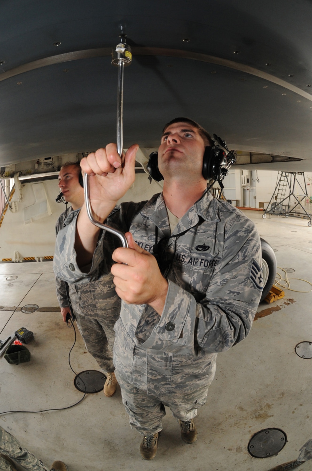 WHITEMAN AIR FORCE BASE, Mo. - Staff Sgt. Eric Hinckley, 509th Aircraft Maintenance Squadron, screws in fasteners around a panel on the B-2 Spirit, Sept. 3. Sergeant Hinckley is using a measuring torque to ensure the fastener has been secured to specified standards.(U.S. Air Force Photo by Airman 1st Class Carlin Leslie)