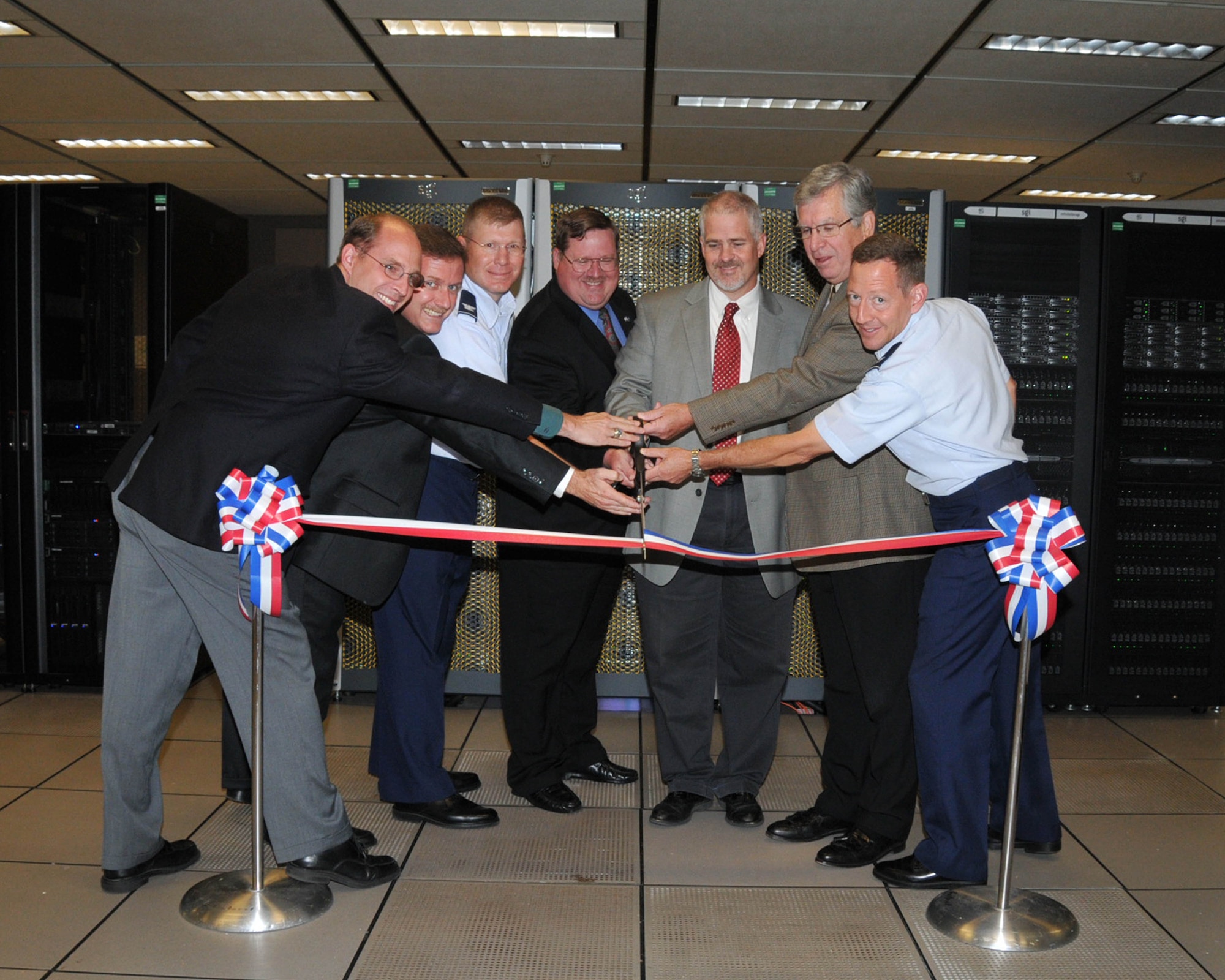 Dr. Edward Kraft, second from right, retiring this month from his position as AEDC Chief Technologist, assists in the ribbon cutting ceremony marking the official debut of the Complex’s Dedicated High Performance Computing lab in 2009. During his time at AEDC, Kraft has seen the Complex and facilities grow and been a part of many technological advances. Pictured from left are AEDC team members Lance Baxter, Mark Rigney, then Col. Robert Bender, Michael Glennon, James Brock, Kraft and then Col. Eugene Mittuch. (U.S. Air Force photo/David Housch)