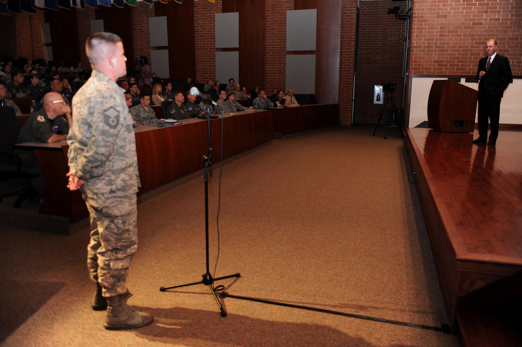 Mr. Gary Kelly answers a question from Master Sgt. Joseph Neubauer, Mobility Operations School, following 45 minutes of motivational remarks to the crowd assembled in Grace Peterson Hall Aug. 12 at the U.S. Air Force Expeditionary Center on the Fort Dix section of Joint Base McGuire-Dix-Lakehurst, N.J.  Mr. Kelly, chief executive officer of SouthWest Airlines, was the fourth speaker in a series of professional development events helping the Center celebrate its 15th Anniversary. (U.S. Air Force Photo/Staff Sgt. Nathan G. Bevier) 
