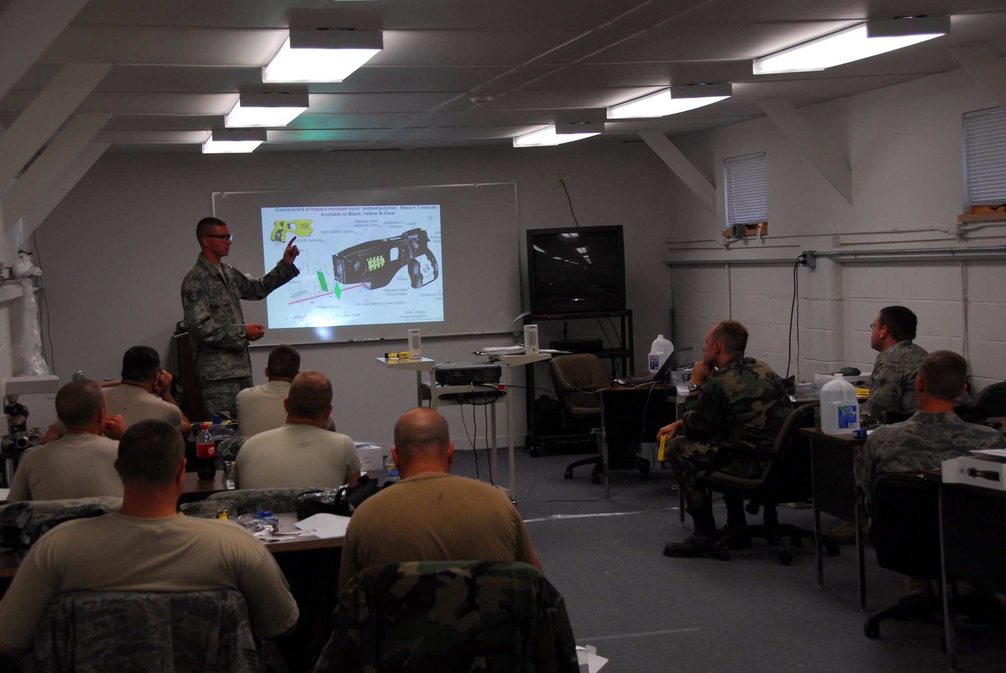Secruity Forces Squadron absorbs the latest taser training. Photo by MSgt John Day