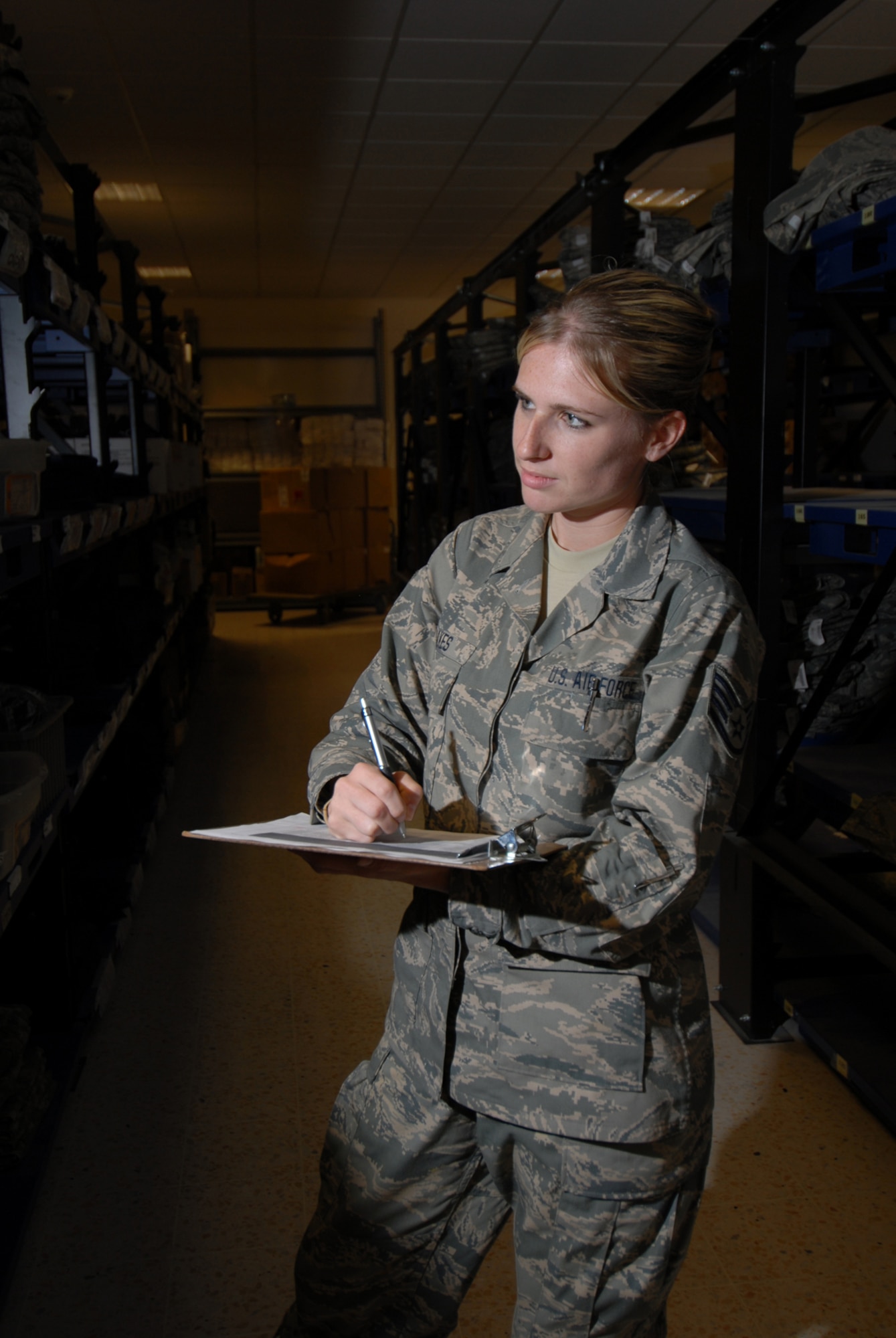 Staff. Sgt. Jill Jakes, 379th Expeditionary Logistics Readiness Squadron purchase order request manager, takes inventory at the Desert Depot here, Sept. 7. The Desert Depot provides base units with a wide range of supplies and equipment essential for ensuring the smooth operations of the day-to-day base mission. Sergeant Jakes is deployed from the New York Air National Guard in support of Operations Iraqi and Enduring Freedom.  (U.S. Air Force Photo/Tech. Sgt. Jason W. Edwards)