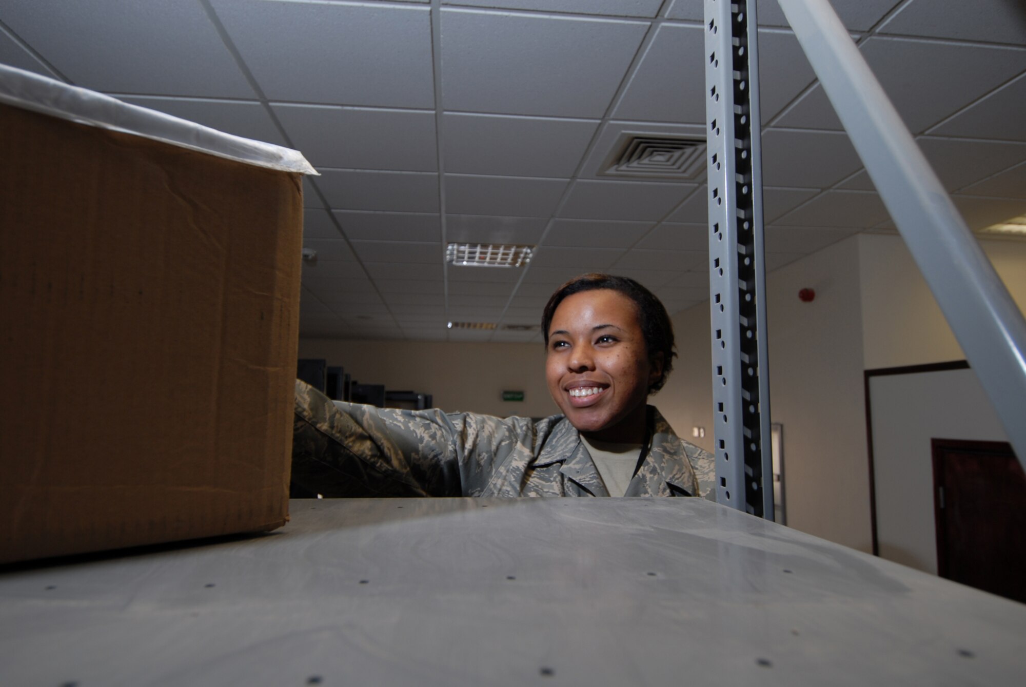 Senior Airman Brenda Williams, 379th Expeditionary Logistics Readiness Squadron asset management journeyman, stocks shelves at the Desert Depot here, Sept. 7. The Desert Depot provides base units with a wide range of supplies and equipment essential for ensuring the smooth operations of the day-to-day base mission. Airman Williams is deployed from Barksdale Air Force Base, La. in support of Operations Iraqi and Enduring Freedom.  (U.S. Air Force Photo/Tech. Sgt. Jason W. Edwards)
