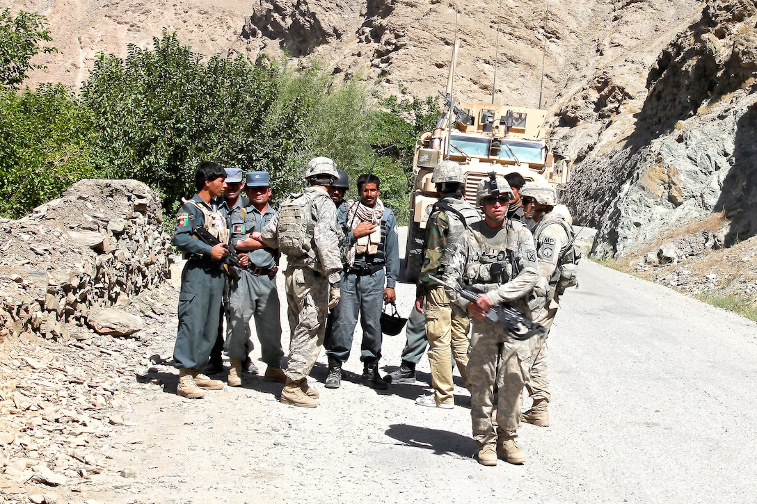 U.S. Army soldiers and Afghan national police officers patrol the streets of the Tangi Valley in the Wardak province, Afghanistan, Aug. 28, 2009. The soldiers are assigned to the 10th Mountain Division’s Company A, 118th Military Police Company, Brigade Special Troops Battalion, 3rd Brigade Combat Team.