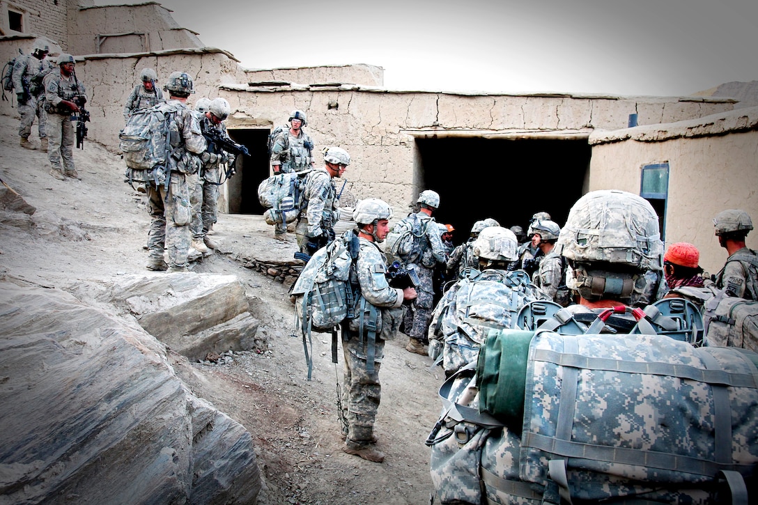 U.S. Army soldiers prepare to go on patrol in the Tangi Valley in the Wardak Province, Afghanistan Aug. 30, 2009. The soldiers are assigned to the 10th Mountain Division’s Company A, 2nd Battalion, 87th Infantry Regiment, 3rd Brigade Combat Team.