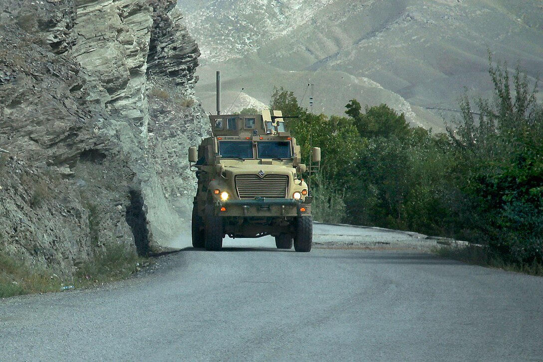 A U.S. Army mine resistant ambush protected vehicle follows a route clearance convoy with soldiers assigned to the 41st Engineers Company, in the Tangi Valley, Wardak province, Afghanistan, Sept. 2, 2009. The soldiers aboard the MRAP are assigned to the 118th Military Police Company, 16th Military Police Brigade.