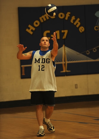 Will Gazaway serves the ball to the 437th Communications Squadron volleyball team during an intramural volleyball match at the Fitness and Sports Center here Sept. 8. There are 12 teams registered to participate during the volleyball season. Gazaway is with the 437th Medical Group. (U.S. Air Force photo/Senior Airman Katie Gieratz)
