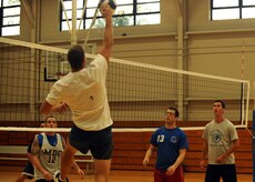 Corey Hughes attempts to spike the ball during an intramural volleyball match at the Fitness and Sports Center here Sept. 8. There are 12 teams registered to participate during the volleyball season. Hughes is with the 437th Communications Squadron. (U.S. Air Force photo/Senior Airman Katie Gieratz)