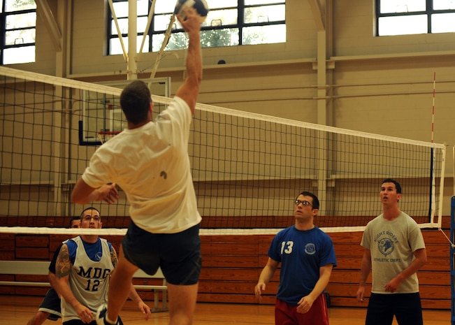 Corey Hughes attempts to spike the ball during an intramural volleyball match at the Fitness and Sports Center here Sept. 8. There are 12 teams registered to participate during the volleyball season. Hughes is with the 437th Communications Squadron. (U.S. Air Force photo/Senior Airman Katie Gieratz)
