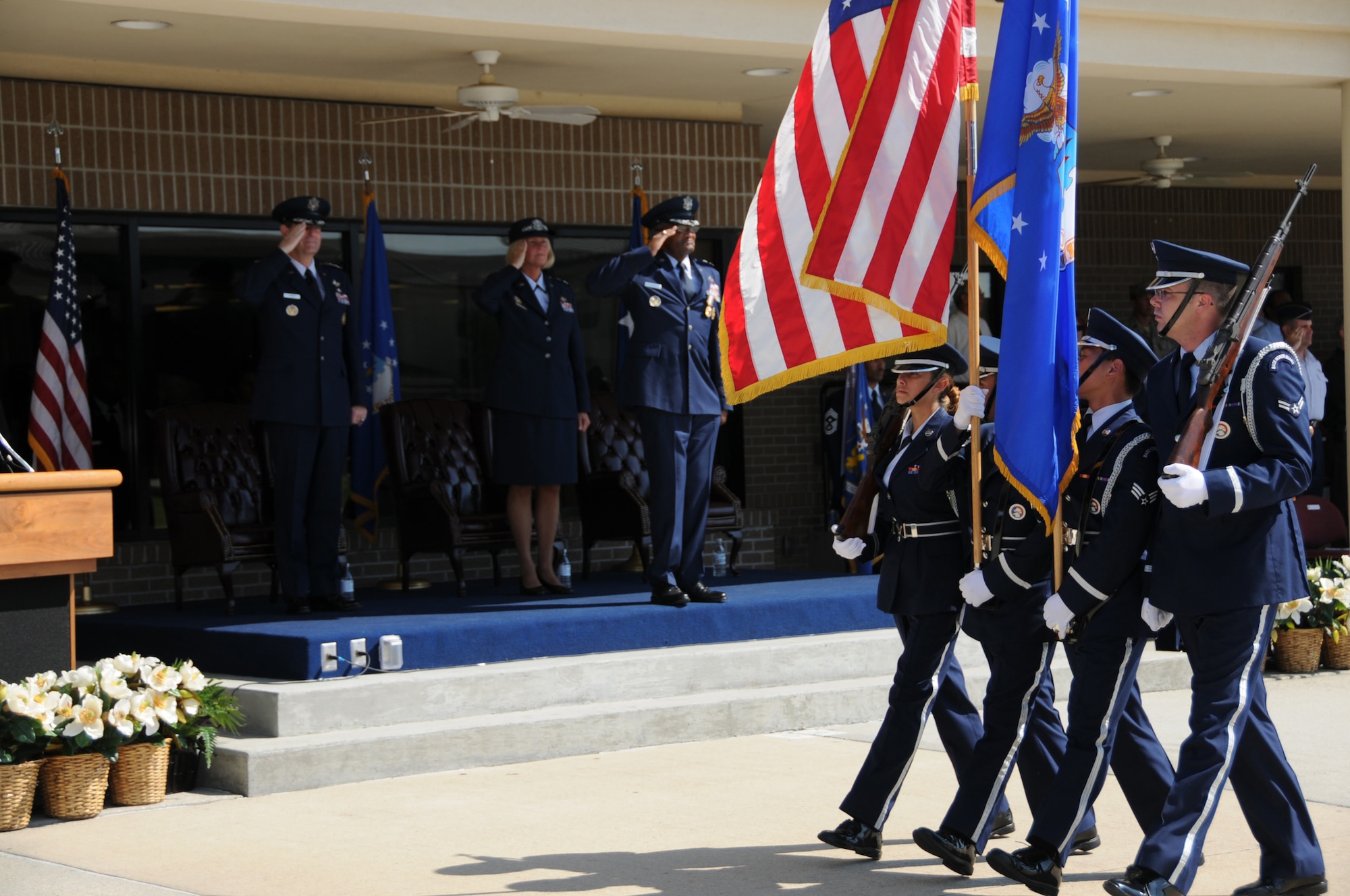 (From Left) Gen. Stephen R. Lorenz, Maj. Gen. Mary Kay Hertog and Maj. Gen. Alfred Flowers salutes the colors as Keesler's honor guard passes during the 2nd Air Force change of command ceremony here Sept. 9. General Hertog took command of 2nd Air Force from General Flowers during the ceremony held at the Levitow Parade Field.  (U.S. Air Force photo by Kemberly Groue)