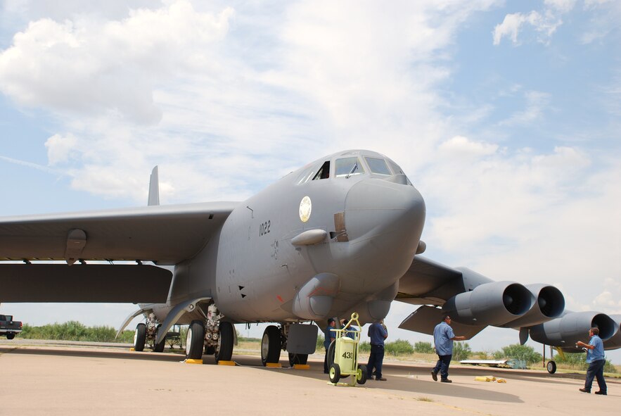 Employees of L3 Communications at Sheppard Air Force Base work to secure a B-52H Stratofortress Sept. 9 after it landed to become a new ground instructional trainer for the 82nd Training Wing. The B-52H, was part of the first strike force to respond to the events of Sept. 11, 2001. The aircraft has nose art in memory of the event and those who lost their lives. (U.S. Air Force photo/John Ingle)