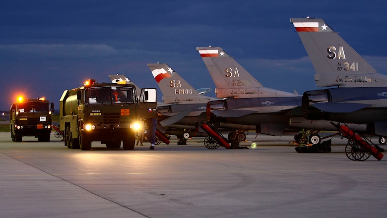 Czech fuel personnel wrap up refueling operatons after F-16s arrivie at Caslav Air Base, Czech Repbulic.  The Texas Air National Guard fighter unit is conducting mutual flight training with their state partnership country. (U.S. Air Force photo/Capt. Randy Saldivar)(RELEASED).