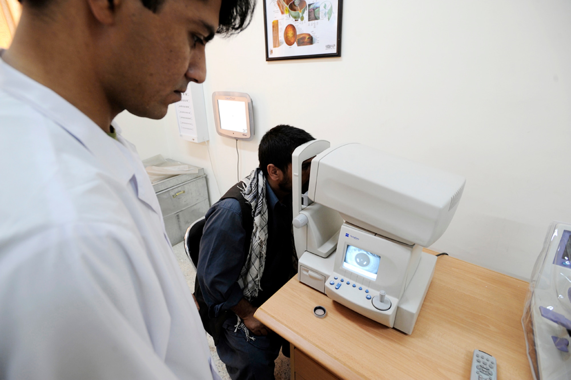 A recruit for the Afghan national army has his vision screened during medical inprocessing Aug 2,2009 at the Kabul Military Training Center in Afghanistan. The medical screening process consists of a drug urinalysis, physical screening and eye exam. (U.S. Air Force photo/Staff Sgt. Shawn Weismiller) 
