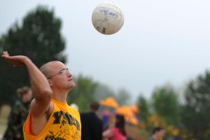 Airman 1st Class Alex Luebrecht, 28th Civil Engineer Squadron engineer technician apprentice, serves during the volleyball competition as part of the Ellsworth Base Picnic here, Sept. 3. The picnic had multiple sporting events including: volleyball, tug of war, dizzy bat racing and basketball. (U.S. Air Force photo by Airman 1st Class Corey Hook)
