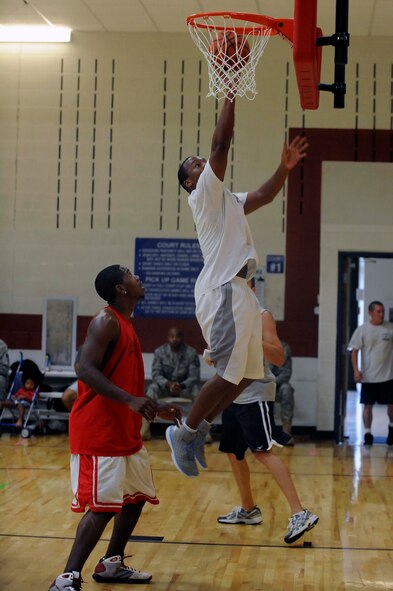 1st Lt. Overton Spence, 28th Comptroller Squadron deputy flight chief, performs a lay-up during the basketball competition as part of the Ellsworth Base Picnic here, Sept. 3. Multiple base organizations sponsored the picnic by providing volunteers, equipment, and food. (U.S. Air Force photo by Airman 1st Class Corey Hook)