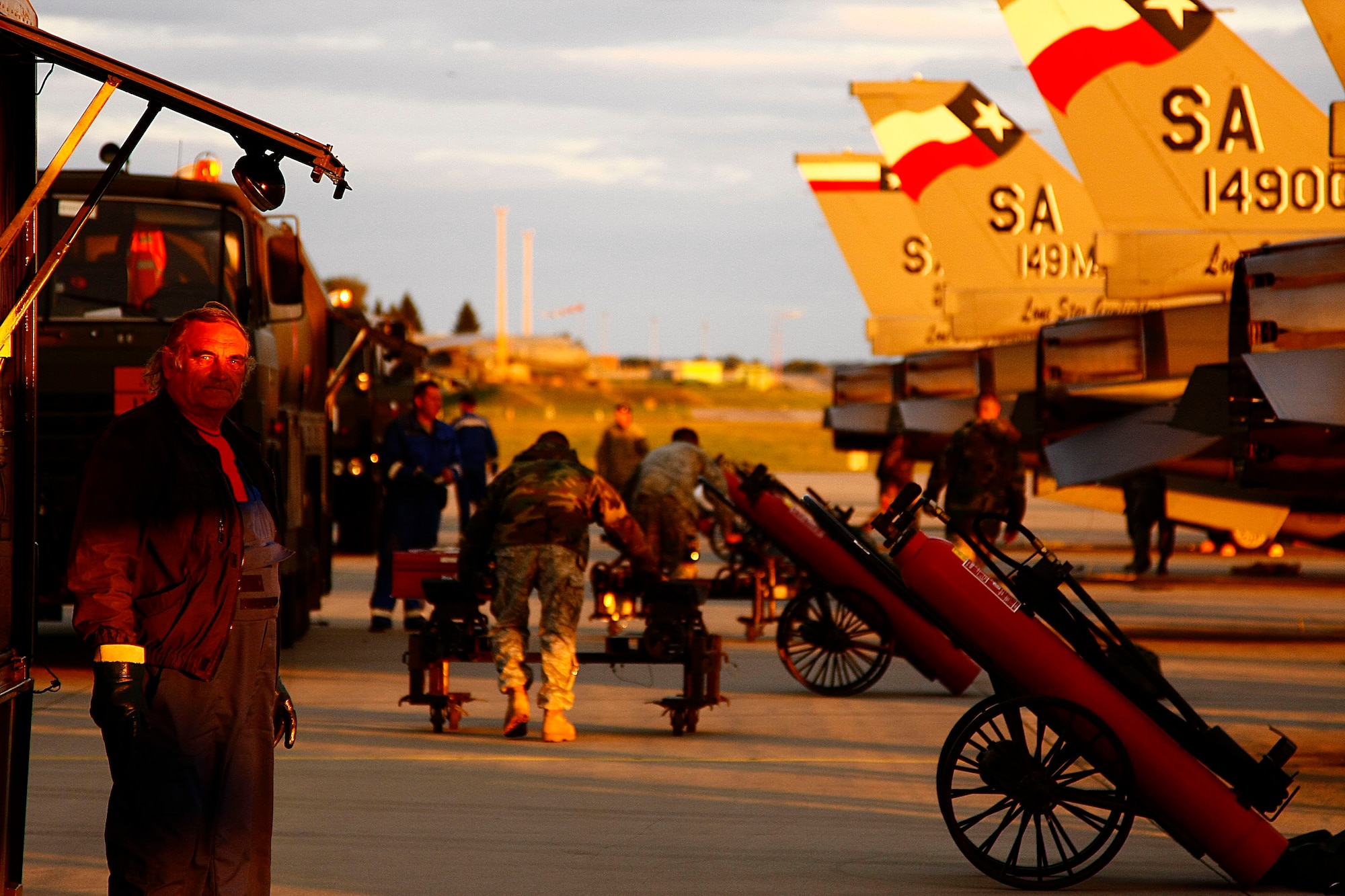 Czech fuel personnel team with members of the 149th Fighter Wing to fuel F-16s after arriving at Caslav Air Base, Czech Repbulic.  The Texas Air National Guard is conducting mutual flight training with their state partnership country. (U.S. Air Force photo/Capt. Randy Saldivar)(RELEASED).