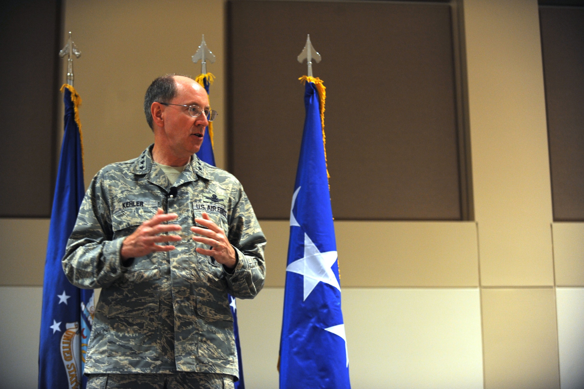 Gen. C. Robert Kehler, Air Force Space Command commander, addresses 460th Space Wing personnel during his commander’s call Sept. 1. The general asked Airmen to stay safe and thanked them for a job well done. (U.S. Air Force photo by Airman 1st Class Paul Labbe)