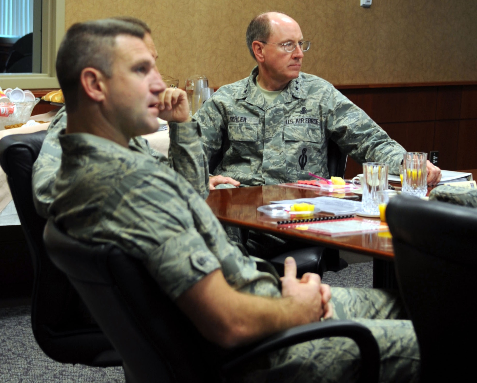 Gen. C. Robert Kehler, Air Force Space Command commander, listens to a briefing at Buckley Air Force Base, Colo. Sept. 1. During his visit, the general discussed Buckley's ongoing growth and the base's importance to the Air Force Space Command mission. (U.S. Air Force photo by Airman 1st Class Paul Labbe)