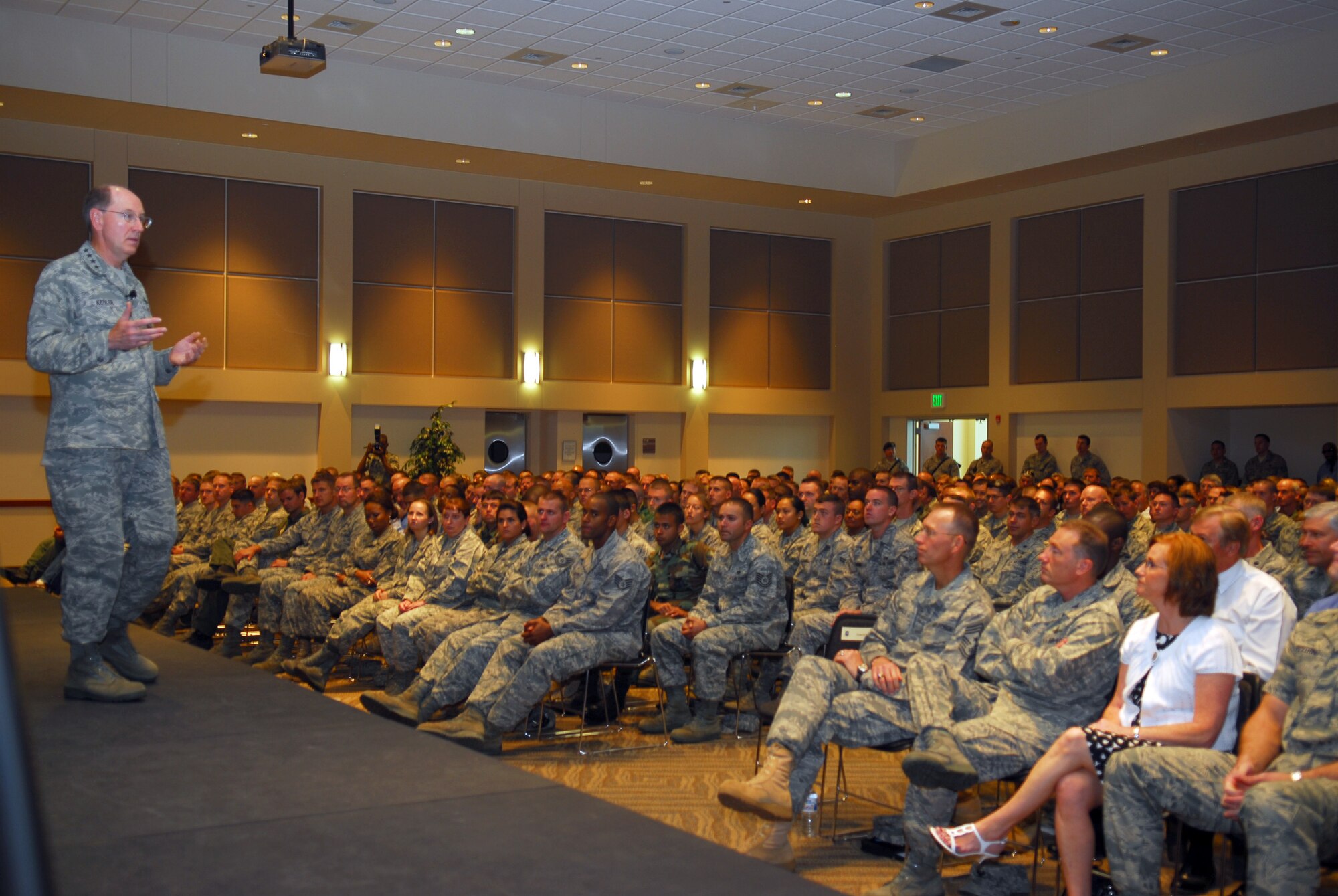 Gen. C. Robert Kehler, Air Force Space Command commander, addresses 460th Space Wing personnel during his commander’s call Sept. 1. General Kehler met with wing, group and tenant unit leadership prior to the commander's call. (U.S. Air Force photo by Staff Sgt. Anika Williams)