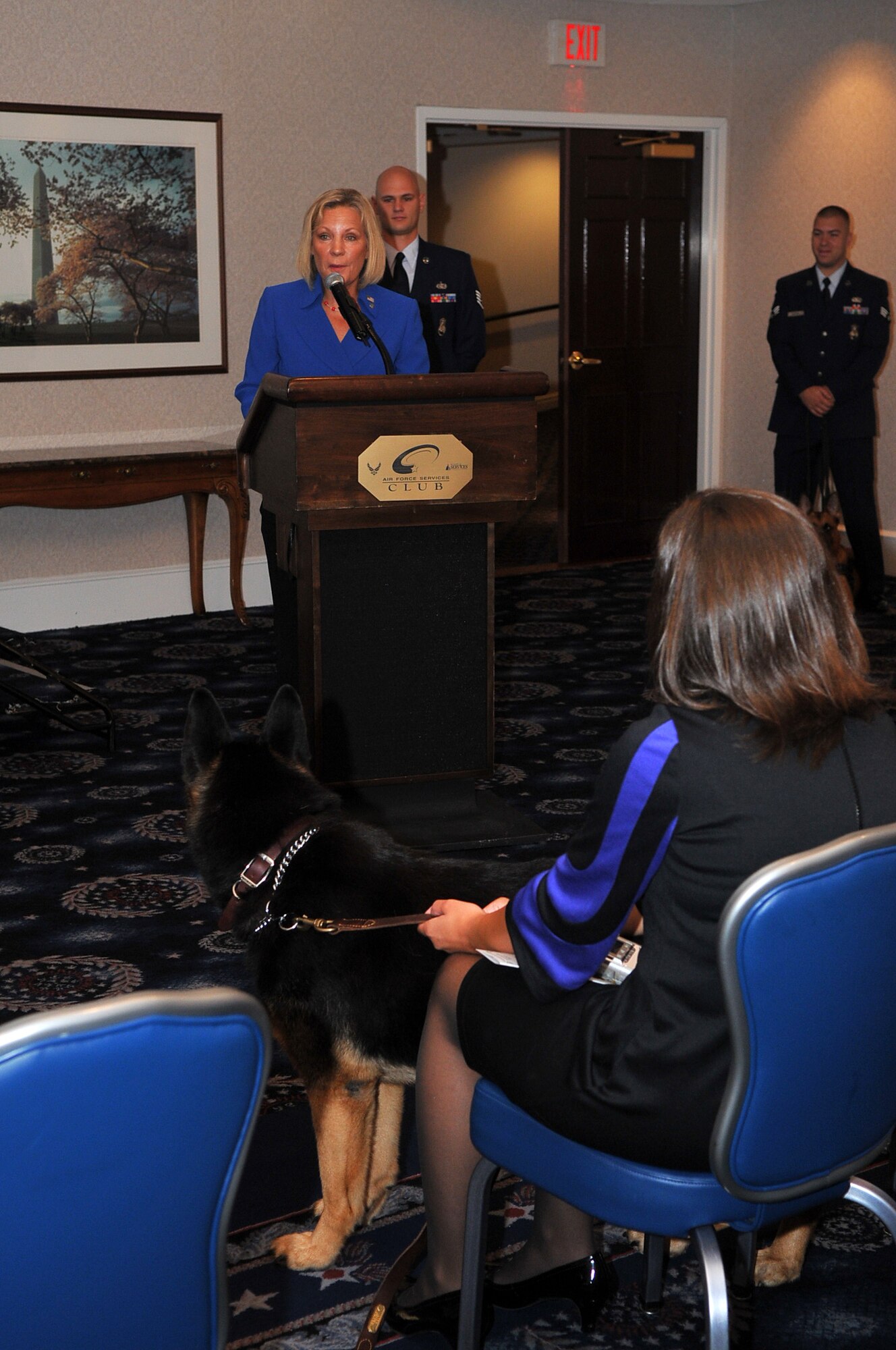 J.T. Gabriel, new owner of military working dog Ben, speaks during Ben’s retirement ceremony Sept. 8 at the Bolling Club. Ben served 11 years as a dual-certified patrol and narcotics-detector military working dog in the Air Force. (U.S. Air Force photo by Senior Airman Marleah Miller)
