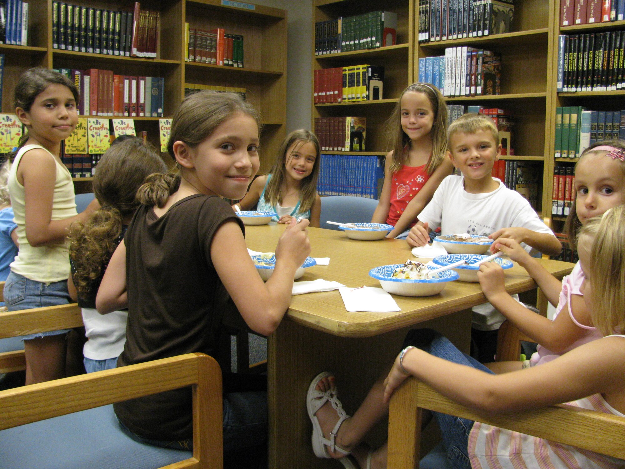 LAUGHLIN AIR FORCE BASE, Texas--Children who completed Laughlin’s Book Mark Library Summer Reading Challenge enjoy ice cream during the annual ice cream social held to celebrate their accomplishment here recently.  This summer, a record 41 children completed the program that challenged them to read 12 books throughout the summer and write a summary of their favorite one. (Courtesy photo)   
