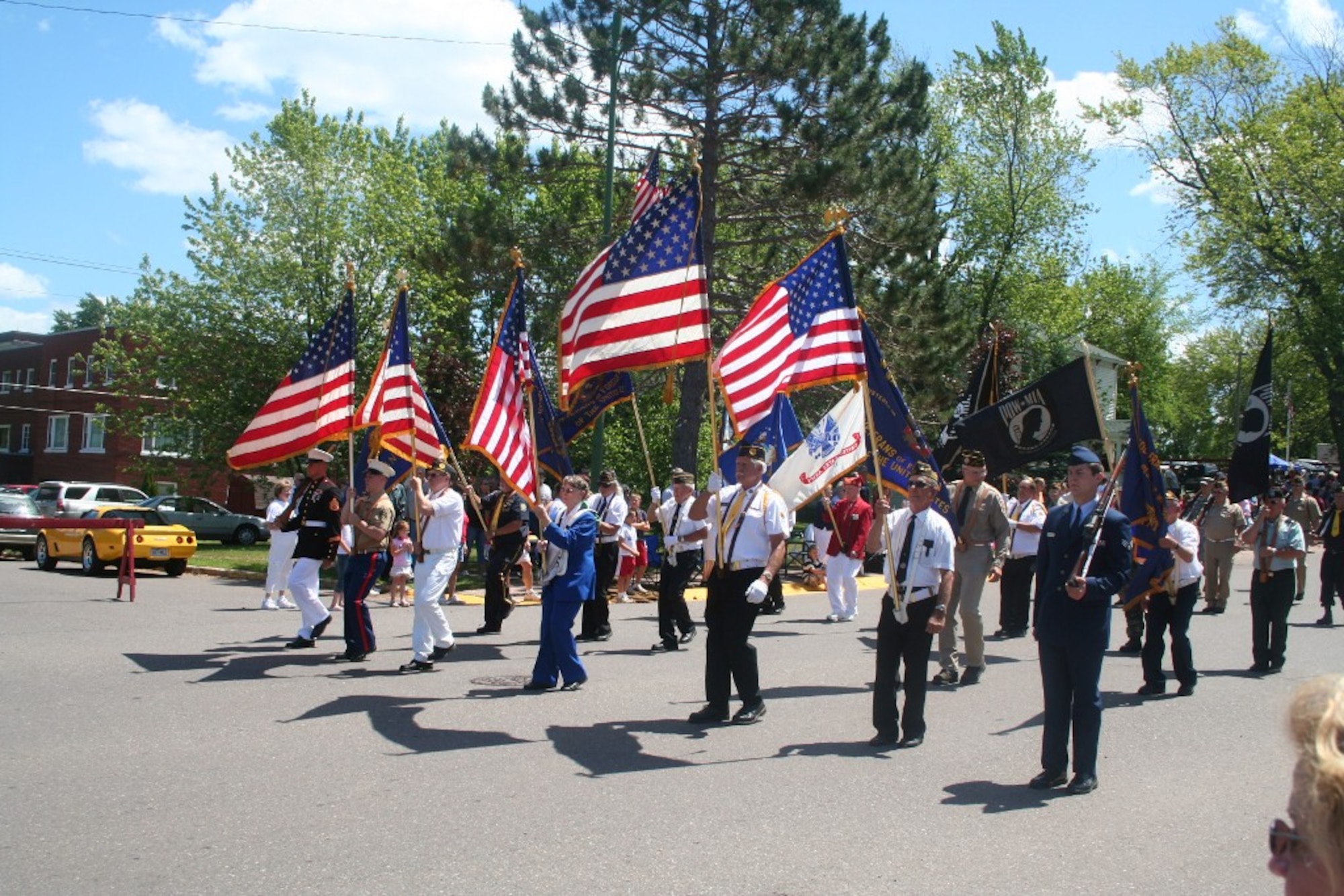 A color guard leads a parade for Independence Day festivities in Wakefield, Mich., on July 4, 2009.  (U.S. Air Force Photo/Tech. Sgt. Scott T. Sturkol)