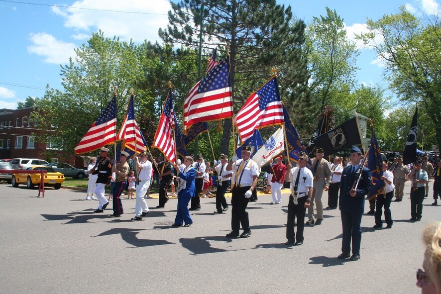 A color guard leads a parade for Independence Day festivities in Wakefield, Mich., on July 4, 2009.  (U.S. Air Force Photo/Tech. Sgt. Scott T. Sturkol)