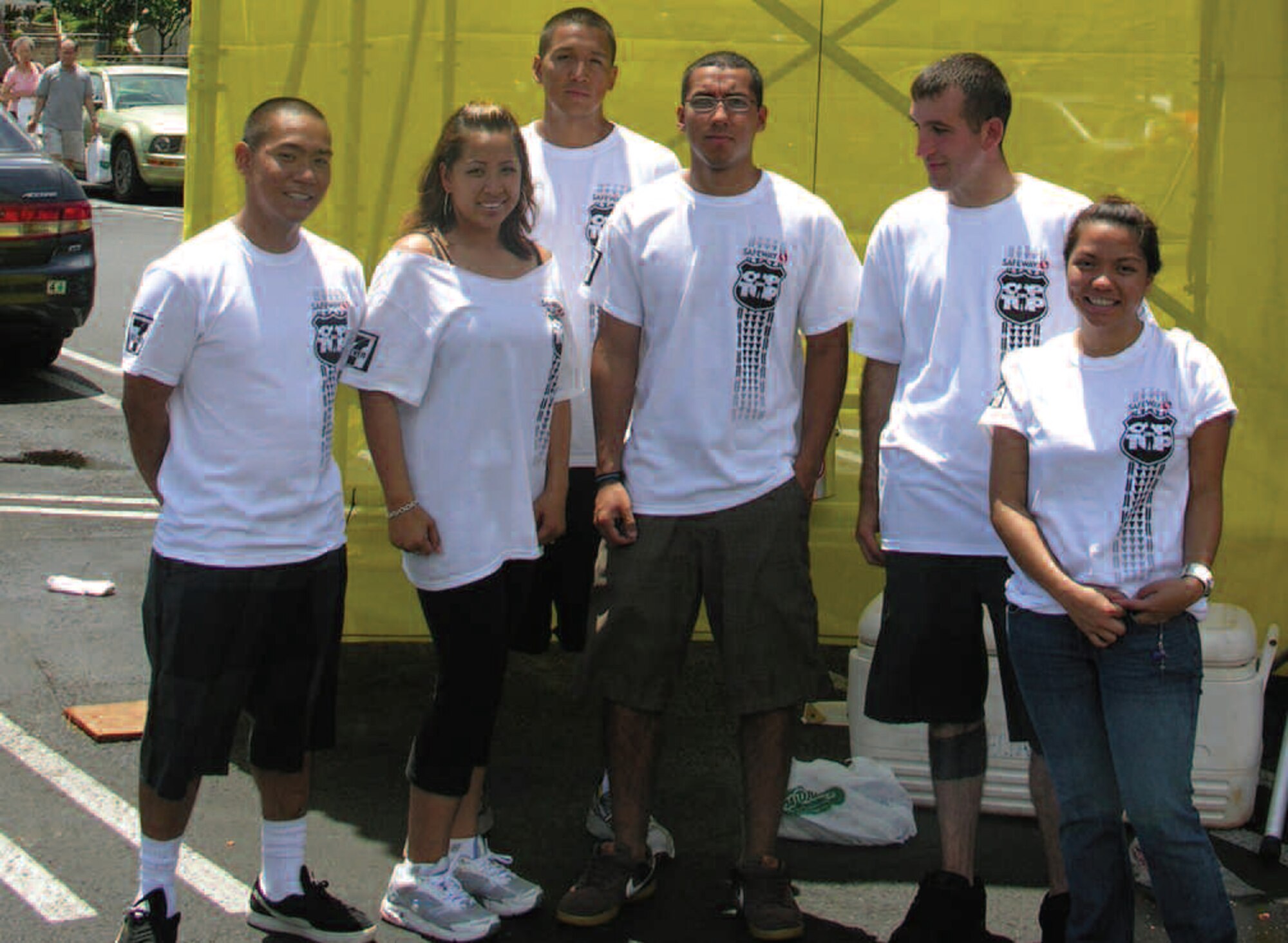 HONOLULU, Hawaii -- Airman 1st Class Michael Somoza, Staff Sgt. Alicia Jiminez, Airman 1st Class Anthony Elizondo, Airman John Olivarez, Senior Airman Matthew Orr and Gouldine Napala (from Hawaii Pacific University) volunteered for the Cop on Top fundraiser to help raise money for Special Olympics. The fundraising event generated $14,000 during the three-day event from the Pali Safeway. (Photo by Mark Doyle)