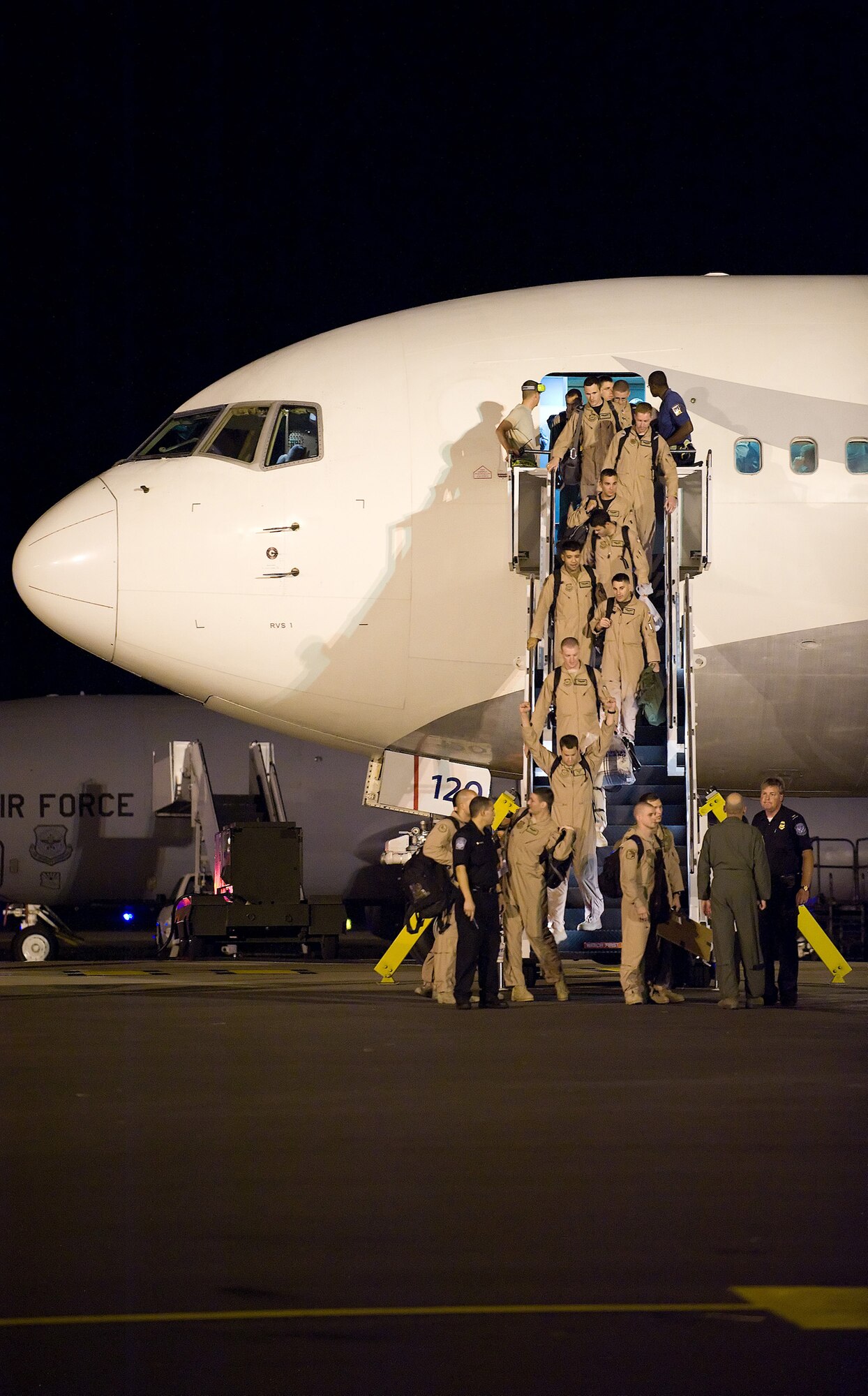 Airmen from the 3rd Airlift Squadron return to Dover Air Force Base Sept. 3, after their four-month deployment to Southwest Asia. The 3rd AS deployed as the 816th Expeditionary  Airlift Squadron to provide combat airlift and airdrop, aeromedical evacuations, humanitarian relief and distinguished visitor movement in the U.S. Central Command area of responsibility. (U.S. Air Force photo/Tom Randle)