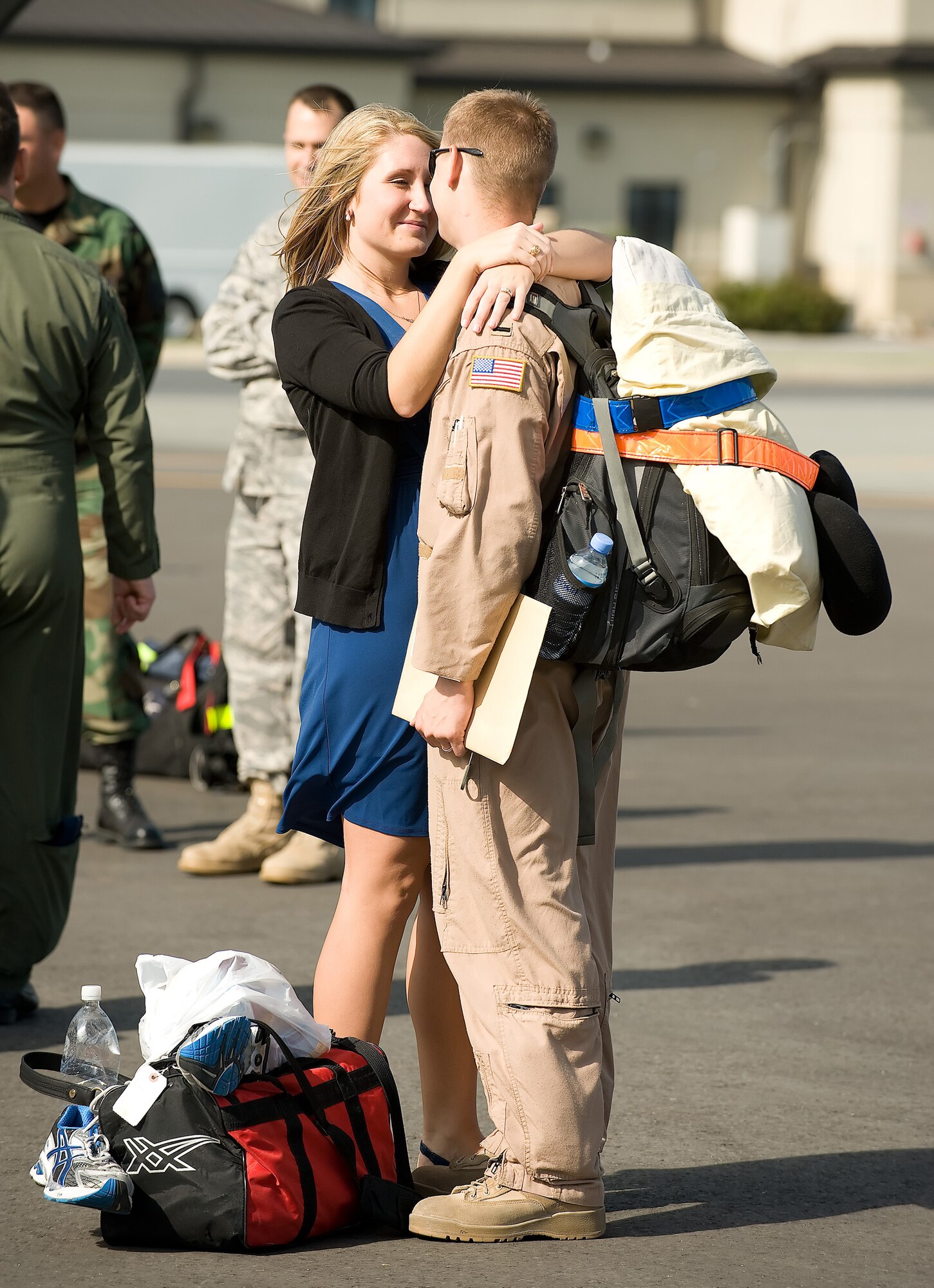 1st Lt. Kyle Modell, 3rd Airlift Squadron, and his wife Jill, embrace on the flightline at Dover Air Force Base Sept. 2. Lieutenant Modell and nearly 120 other members of the 3rd AS, returned from their deployment to Southwest Asia.