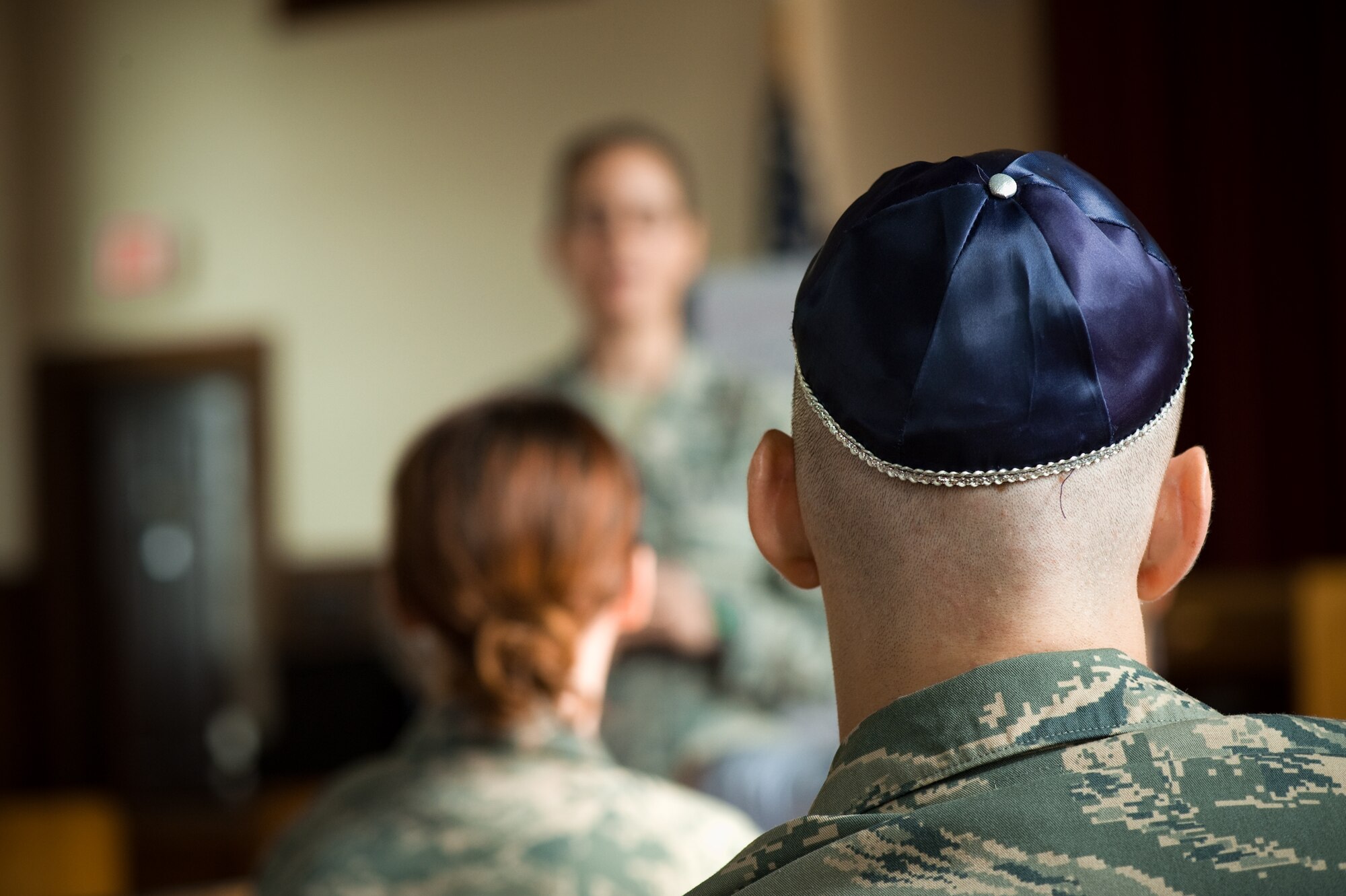 Trainees Eric Smith (right wearing the kippah, religious head covering) and Cassandra Bridges( left) listen to U.S. Air Force Rabbi, Chaplain, Captain Sarah D. Schechter leading the evening le'il shabbat service on Friday, Sept. 4, 2009 at Lackland Air Force Base's Airmen Memorial Chapel. The more than 25 basic military trainees and other attendees participated in a religious education class, then Ma'ariv prayer service for the setting of the sun, followed by a meal provided by lay leaders supporting the service. Because of training schedules some ceremonies and events are earlier than traditionally held. By order of commanders, those who want to attend any or all religious services of their choosing are given full permission and opportunity to do so.  (U.S. Air Force photo/Lance Cheung)

