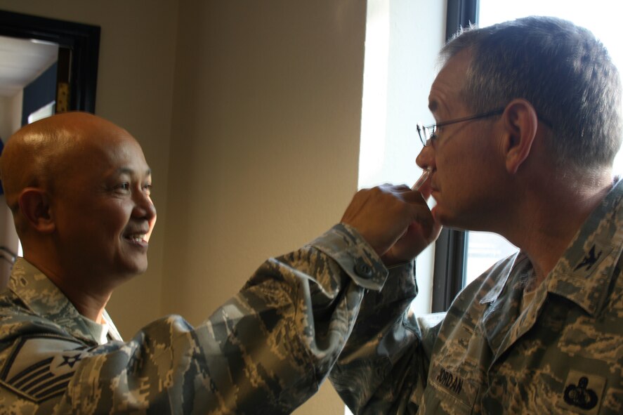RAF ALCONBURY -  Col. John Jordan, 501st Combat Support Wing vice commander, prepares for the upcoming flu season by getting his required flu vaccination from Master Sgt. Ron Geronimo, 423rd Medical Squadron. Active duty members will be able to receive the mandatory shot or mist form soon and will be notified of times and places.