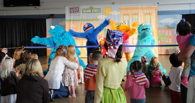 RAF MILDENHALL, England -- About 1,000 people attended Sesame Workshop/United Service Organization free traveling tour shows in the Northside Fitness Center here Sept. 8. The show titled "Talk, Listen, Connect" began its eight-week European tour here to help teach children how to cope with the unique challenges military families face. The tour will then move to Alaska, Hawaii and Asia. (U.S. Air Force photo/Senior Airman Thomas Trower) 