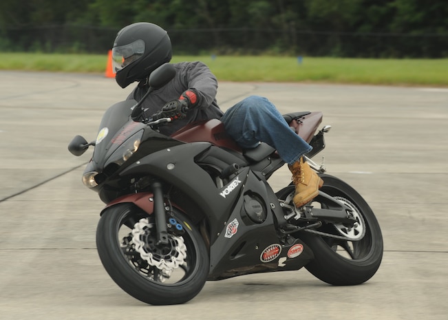 Staff Sgt. Rushad Stroman performs a move during the Sport Bike Course on the Charleston AFB flightline Sept. 2. The motorcycle course allows riders to become more competent with their bike in an environment significantly safer than public roads. Sergeant Stroman is an electrical and environmental maintainer with the 437th Aircraft Maintenance Squadron. (U.S. Air Force photo/Senior Airman Katie Gieratz) (RELEASED)