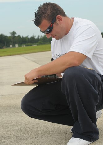 Staff Sgt Michael St. Pierre grades students during the Sport Bike Course on Charleston AFB's flightline Sept. 2. The motorcycle course allows riders to become more competent with their bike in an environment significantly safer than public roads. Sergeant St. Pierre is an aircraft mechanic with the 315th Maintenance Squadron. (U.S. Air Force photo/Senior Airman Katie Gieratz)  