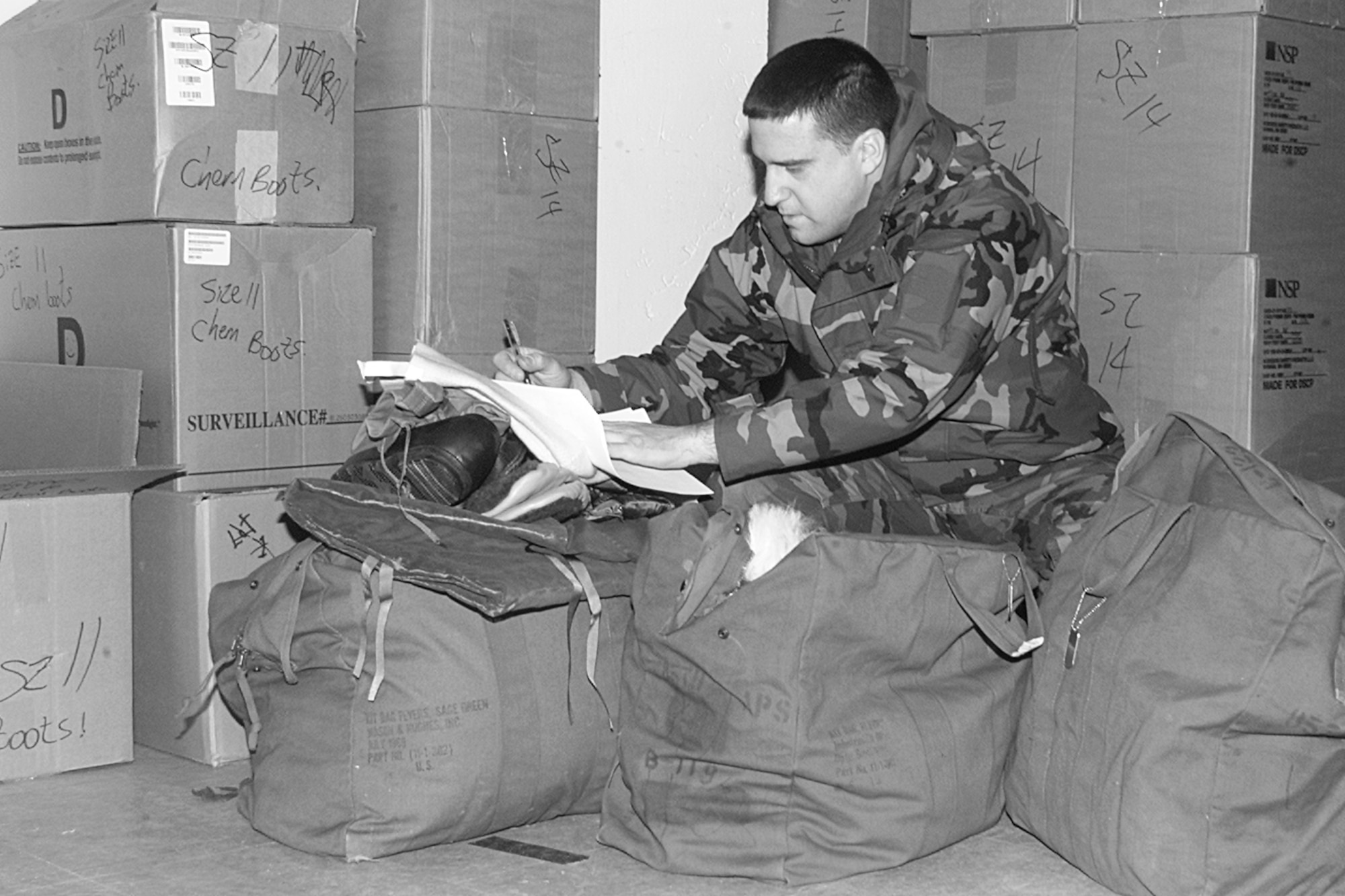 HANSCOM AIR FORCE BASE, Mass. - Tech. Sgt. Michael Welch, 85th Aerial Port Squadron, inventories his deployment equipment prior to being deployed to support Army cargo and personnel movements into and out of Southwest Asia. Sergeant Welch and other members of the 85 APS activated in early 2004, among multiple other occasions, to support Operations Iraqi and Enduring Freedom. The 85 APS deactivates Sept. 13 at 11 a.m. during a ceremony held at the Hanscom Aero Club Hangar after nearly 50 years of aerial port operations supporting the nation’s wartime and peacetime military and humanitarian campaigns since 1960.(U.S. Air Force photo by Linda LaBonte Britt)