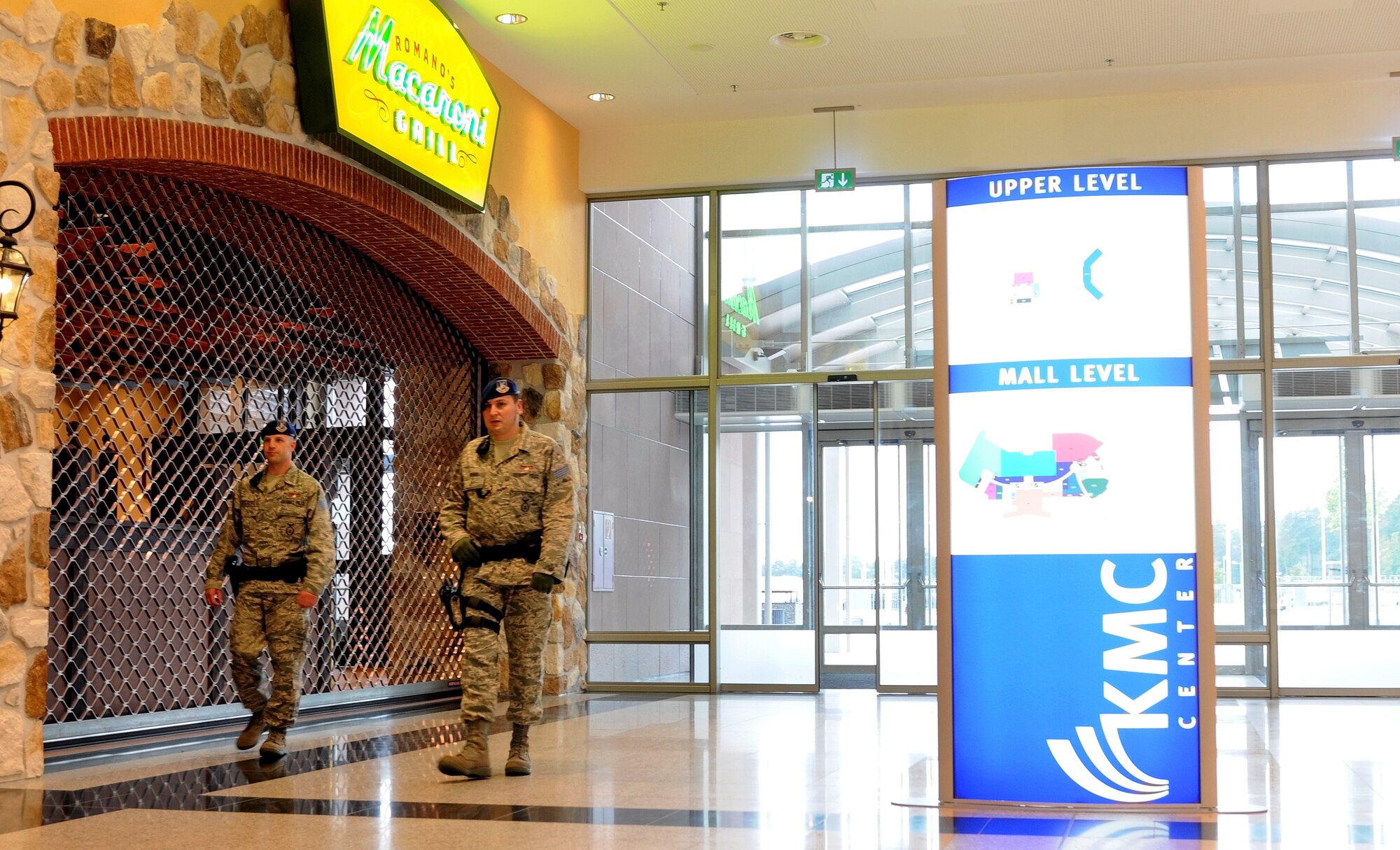 Civilian Police Thorsten Volkert and Markus Wendel, members of the 86th Security Forces Squadron, patrol through the Kasierslatuern Military Community Center at Ramstein Air Base, Germany, August 11, 2009. The KMCC is designed to provide a one-stop shopping center for travelers and those stationed in the KMC. The consolidated facility is approximately 800,000 square feet (78,000 square meters) and includes an eight-story, 350-room visiting quarters facility. (U.S. Air Force photo by Tech. Sgt. Sean White)