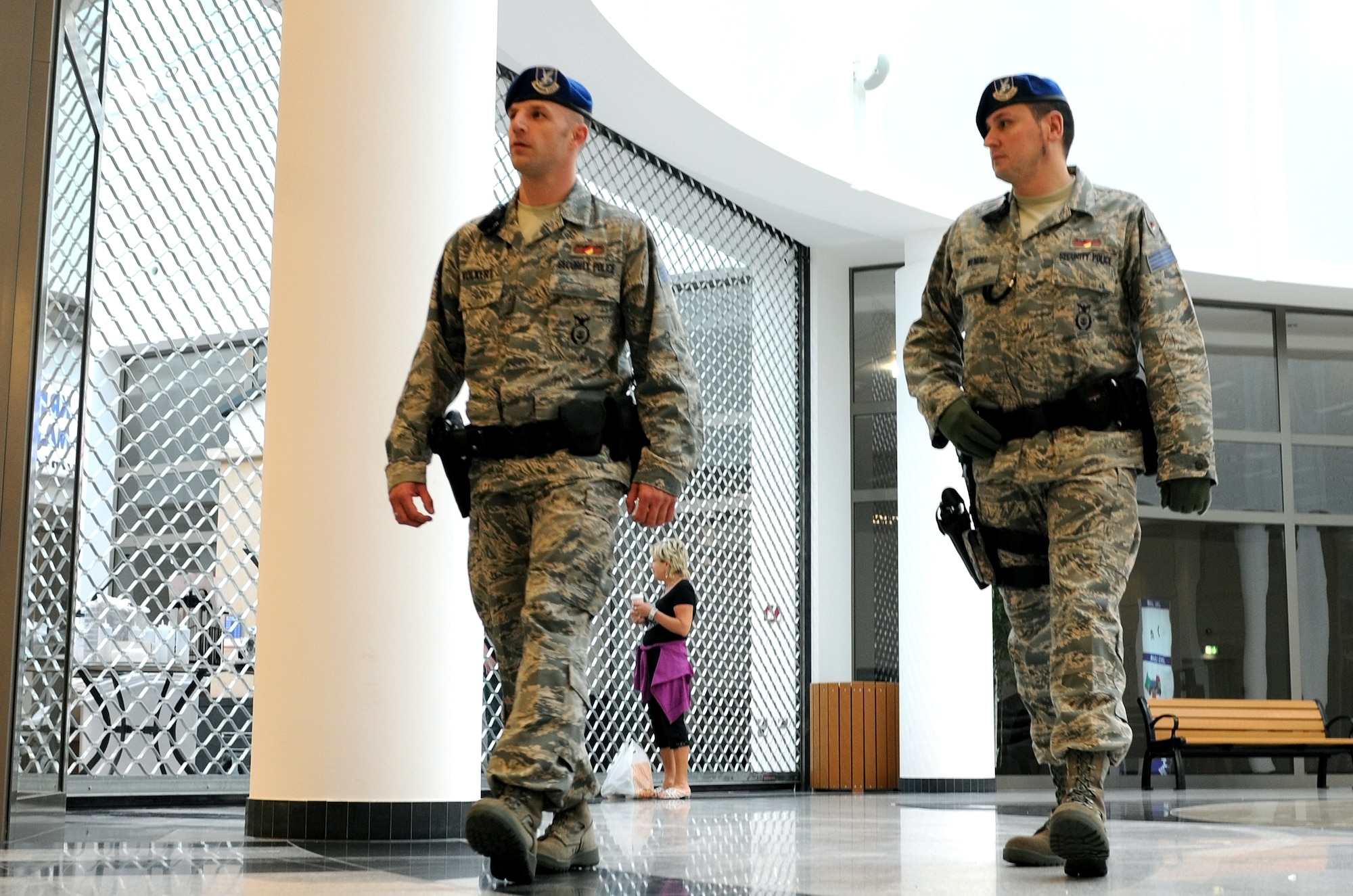 Civilian Police Thorsten Volkert and Markus Wendel, members of the 86th Security Forces Squadron, patrol through the Kasierslautern Military Community Center at Ramstein Air Base, Germany, August 11, 2009. The KMCC is designed to provide a one-stop shopping center for travelers and those stationed in the KMC. The consolidated facility is approximately 800,000 square feet (78,000 square meters) and includes an eight-story, 350-room visiting quarters facility. (U.S. Air Force photo by Tech. Sgt. Sean White)