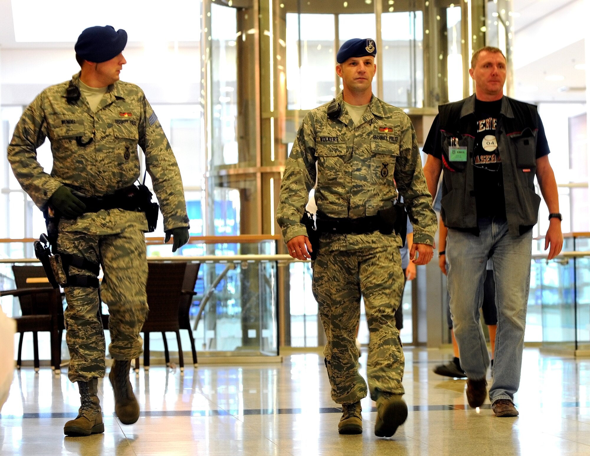 Civilian Police Markus Wendel and Thorsten Volkert, members of the 86th Security Forces Squadron, patrol through the Kasierslautern Military Community Center (KMCC) at Ramstein Air Base, Germany, August 11, 2009. The KMCC is designed to provide a one-stop shopping center for travelers and those stationed in the KMC. The consolidated facility is approximately 800,000 square feet (78,000 square meters) and includes an eight-story, 350-room visiting quarters facility. (U.S. Air Force photo by Tech. Sgt. Sean White)