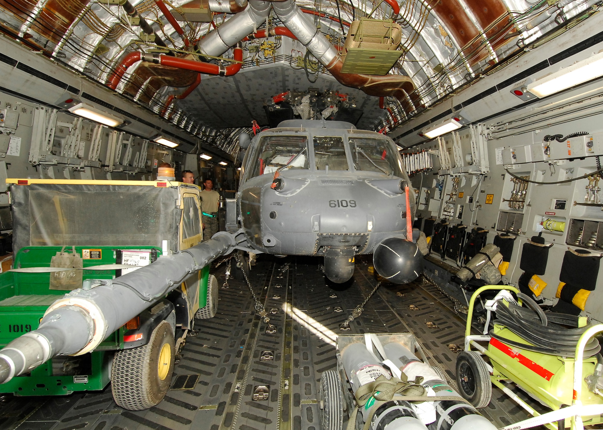 BAGRAM AIRFIELD, Afghanistan -- An HH-60G Pave Hawk, secure on the C-17 Globemaster III, awaits take off here, Sept. 9, 2009. The Pave Hawks at Bagram Airfield are attached to the 56th Expeditionary Rescue Squadron.  The C-17 is transporting the squadron's helicopters back to home station for their redeployment.  The Pave Hawk's primary wartime mission is combat search and rescue. The Globemaster III is a versatile transport aircraft and its cargo compartment is designed to carry a wide range of cargo to include large vehicles, including tanks and helicopters.  (U.S. Air Force photo/Senior Airman Felicia Juenke)