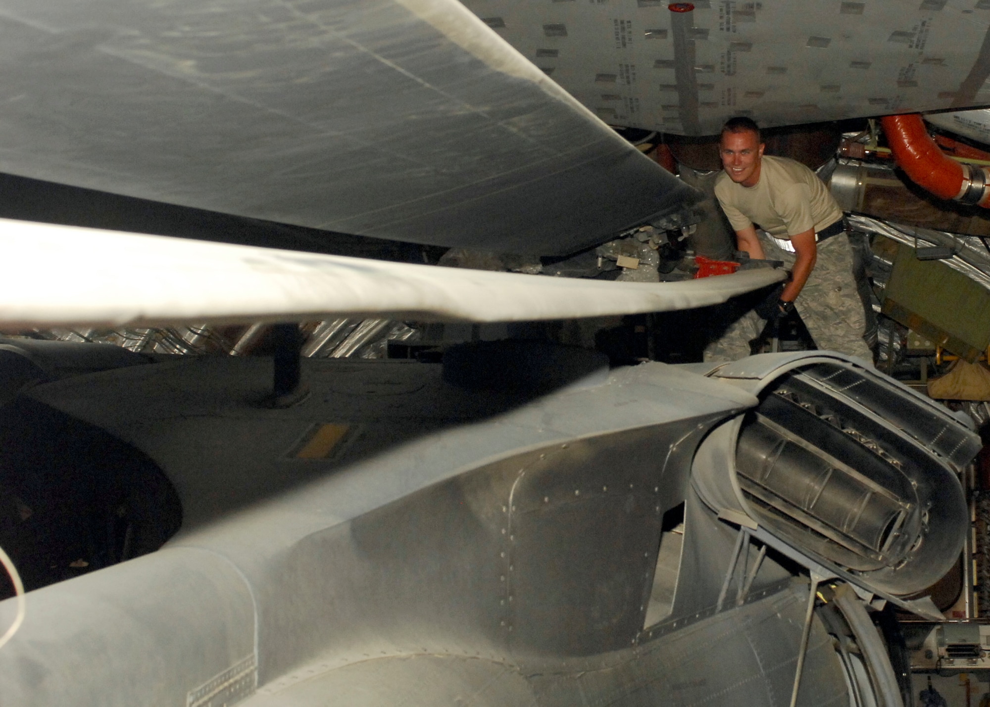 BAGRAM AIRFIELD, Afghanistan -- Staff Sgt. Trevor Smith, a helicopter crew chief from the 455th Expeditionary Aircraft Maintenance Squadron, ensures the rotors do not move on the HH-60G Pave Hawk during a final check of the aircraft here, Sept. 9, 2009.  The Pave Hawk must be secure on the C-17 Globemaster III to ensure it doesn't get damaged in flight back to its home station.  Sergeant Smith is deployed from RAF Lakenheath, England, and hails from Duluth, Minn.  (U.S. Air Force photo/Senior Airman Felicia Juenke)