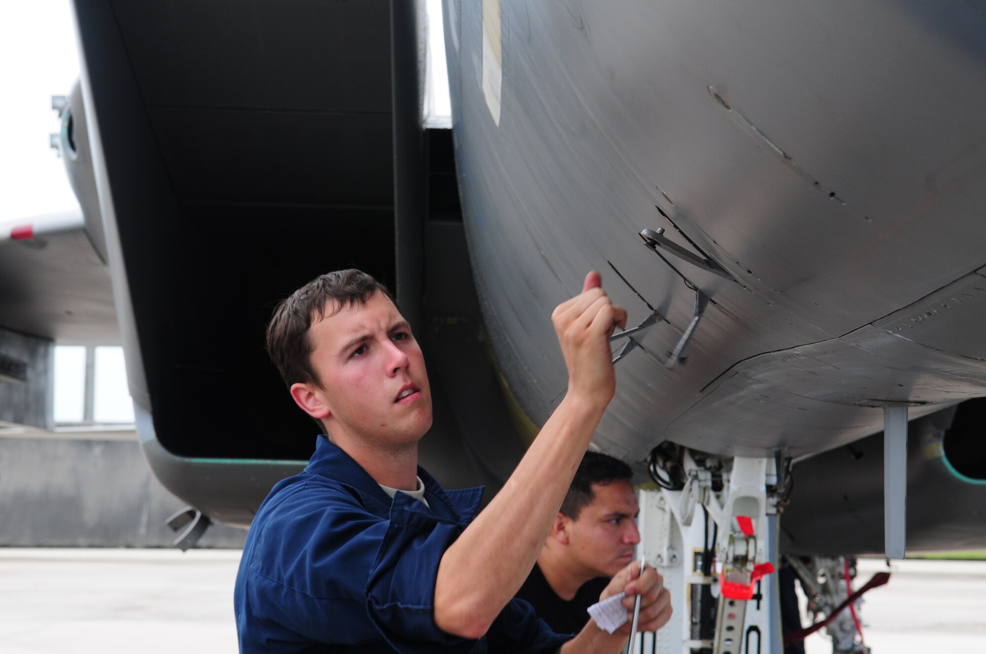 Airman 1st Class Steven Seildel, a 67th Fighter Squadron crew chief, removes a panel on an F-15 while deployed to Andersen Air Force Base, Guam.
(U.S. Air Force Photo/Tech. Sgt. Mike Tateishi)